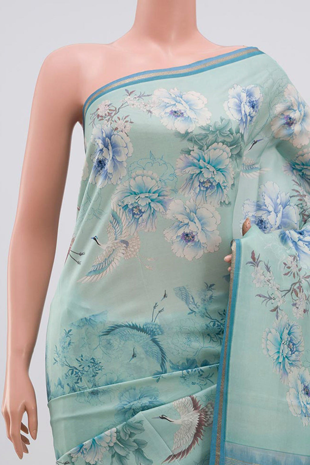 Border image of Sky Blue Printed Silk Saree with Floral Print on the body and Zari Border. 