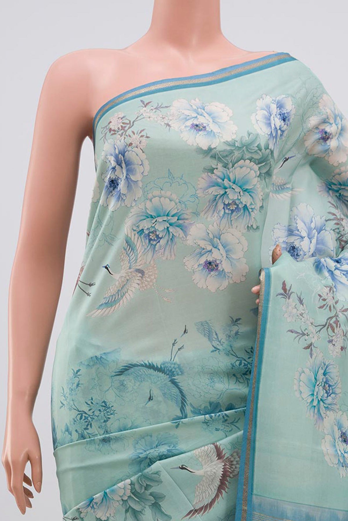 Border image of Sky Blue Printed Silk Saree with Floral Print on the body and Zari Border. 