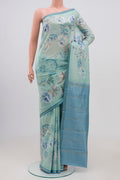 Sky Blue Printed Silk Saree with Floral Print on the body and Zari Border.  displayed on a mannequin