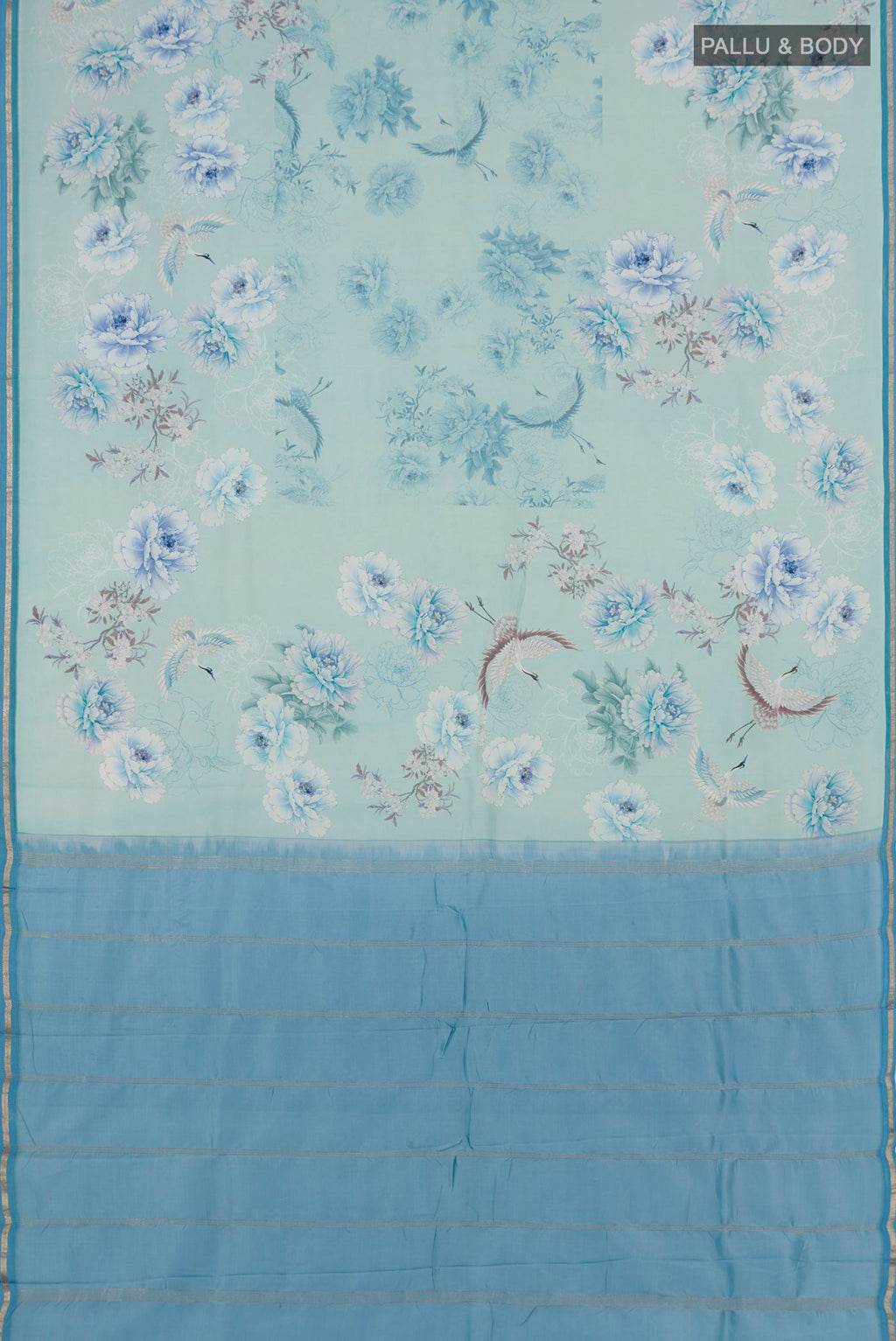 Flat view of Sky Blue Printed Silk Saree with Floral Print on the body and Zari Border. 