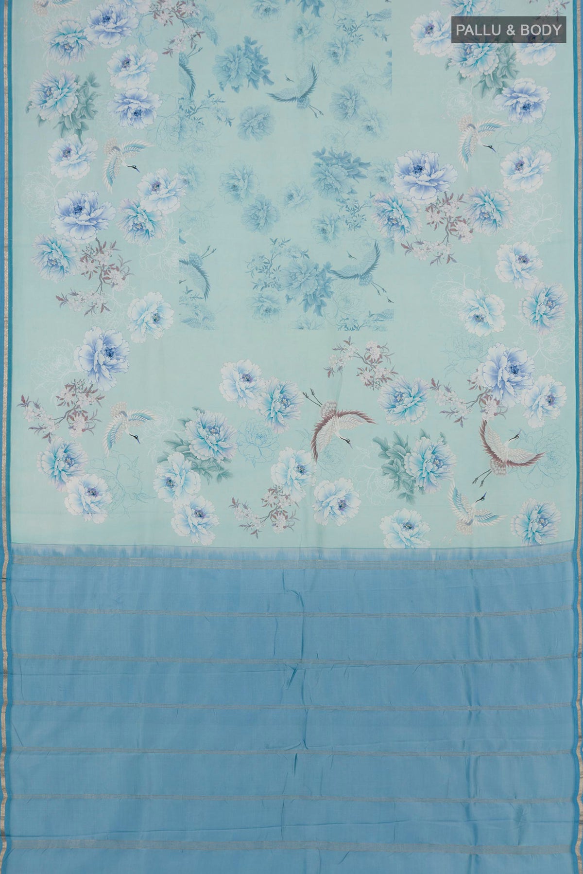 Flat view of Sky Blue Printed Silk Saree with Floral Print on the body and Zari Border. 