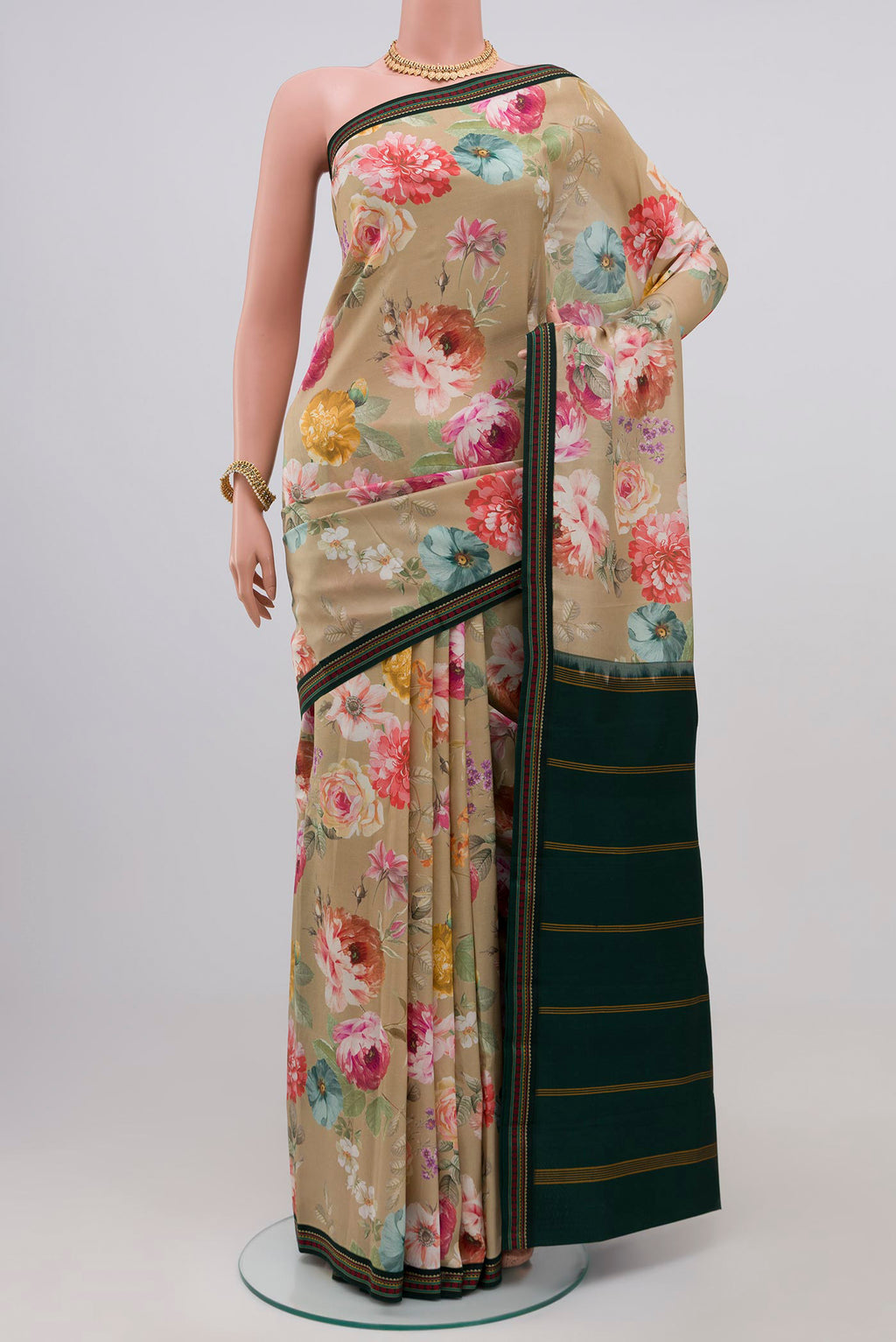 Beige Printed Silk Saree with Printed design on the body and Thread Border.  displayed on a mannequin