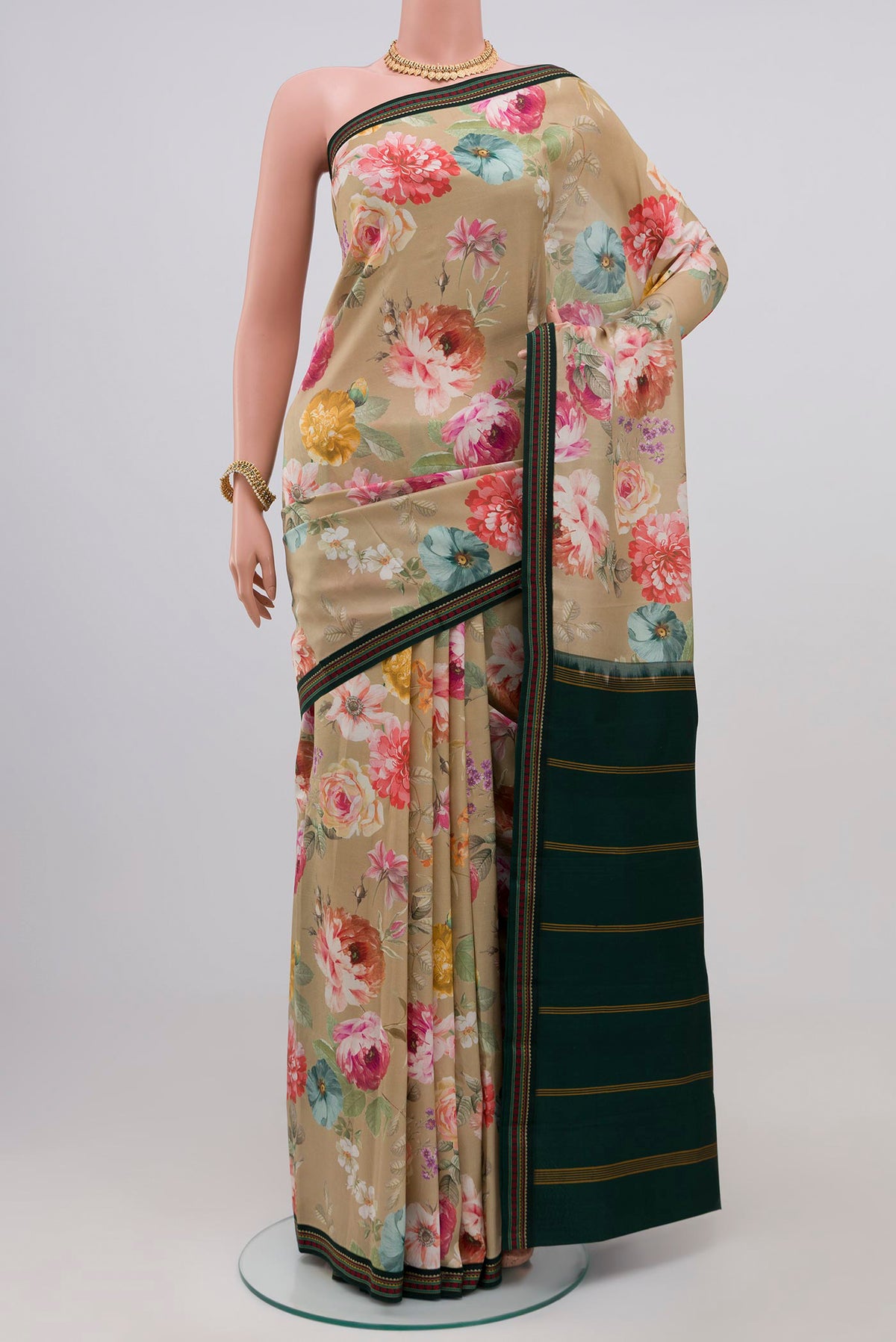 Beige Printed Silk Saree with Printed design on the body and Thread Border.  displayed on a mannequin