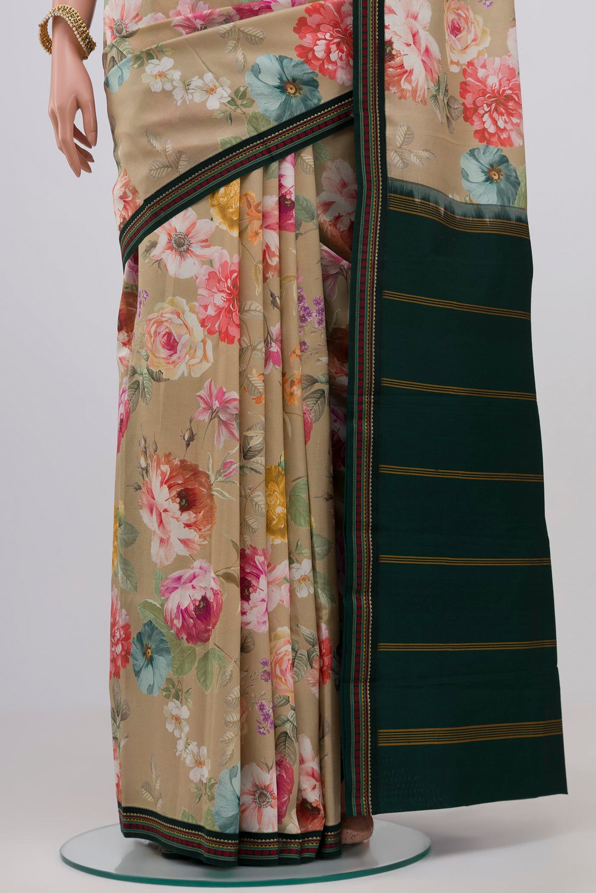 Pleats and pallu of Beige Printed Silk Saree with Printed design on the body and Thread Border. 