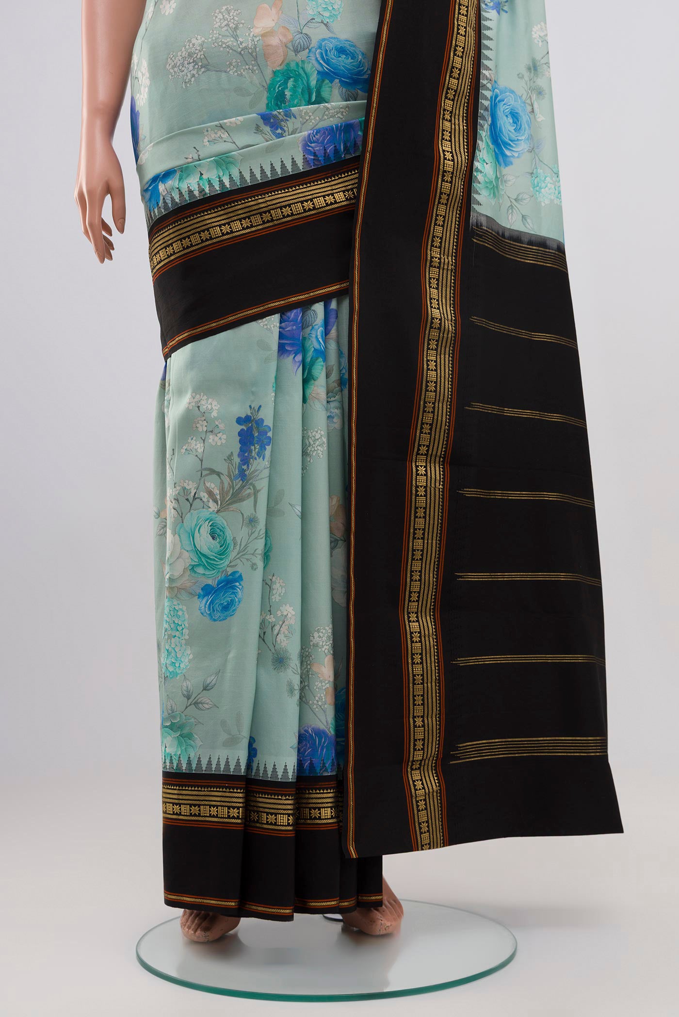 Pleats and pallu of Sky Blue Printed Silk Saree with Fancy on the body and Zari Border. 