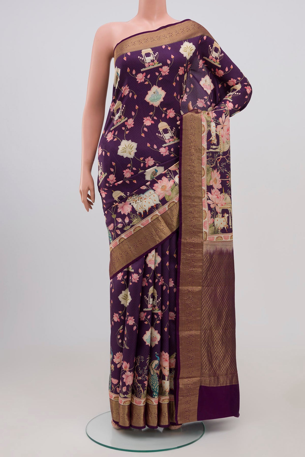 Purple Mysore Silk Saree with Floral Print on the body and Zari Border.  displayed on a mannequin