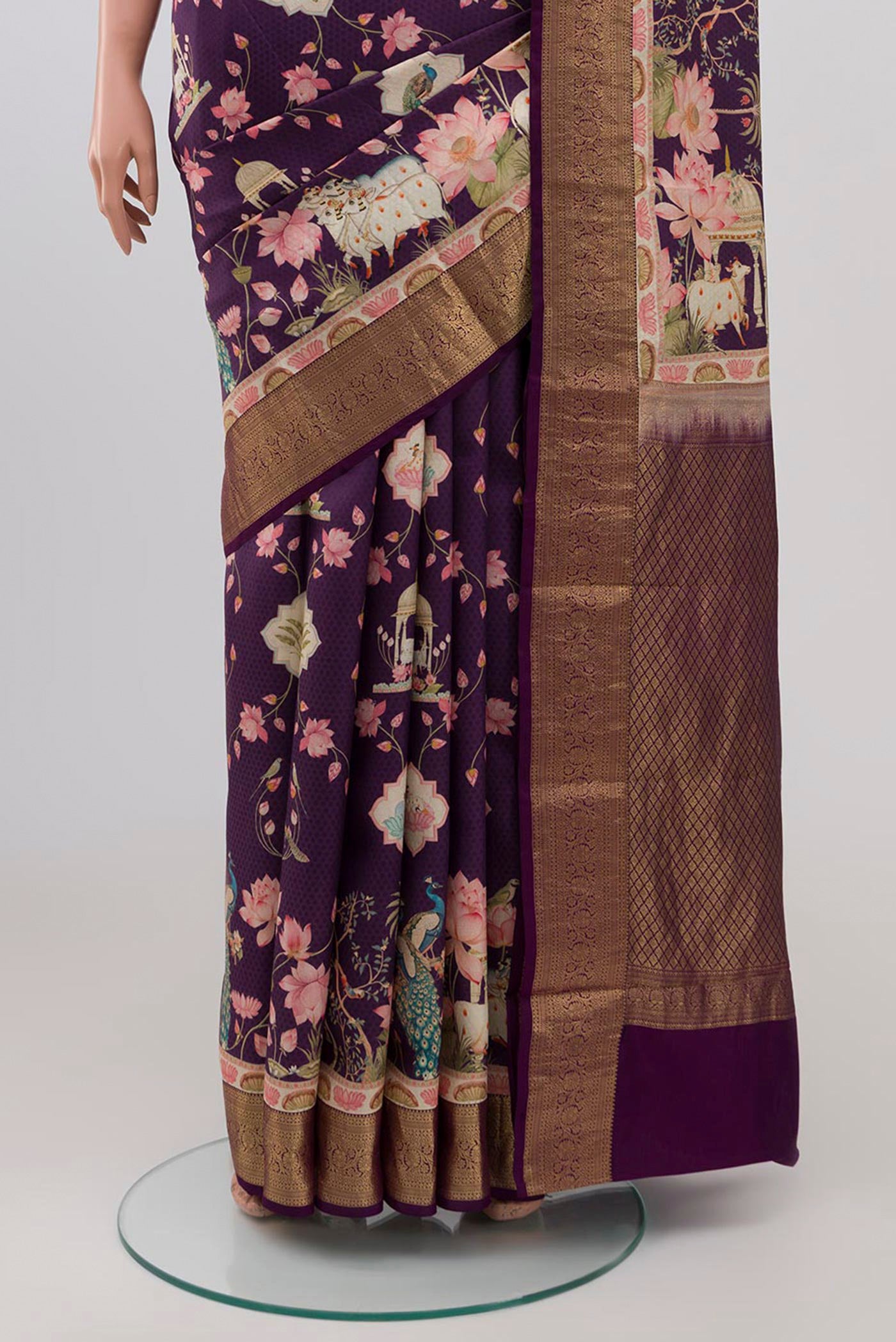 Pleats and pallu of Purple Mysore Silk Saree with Floral Print on the body and Zari Border. 