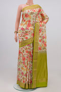 Light Green Printed Silk Saree with Printed design on the body and Zari Border.  displayed on a mannequin