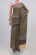 Beige Printed Silk Saree with Printed design on the body and Plain Border.  displayed on a mannequin