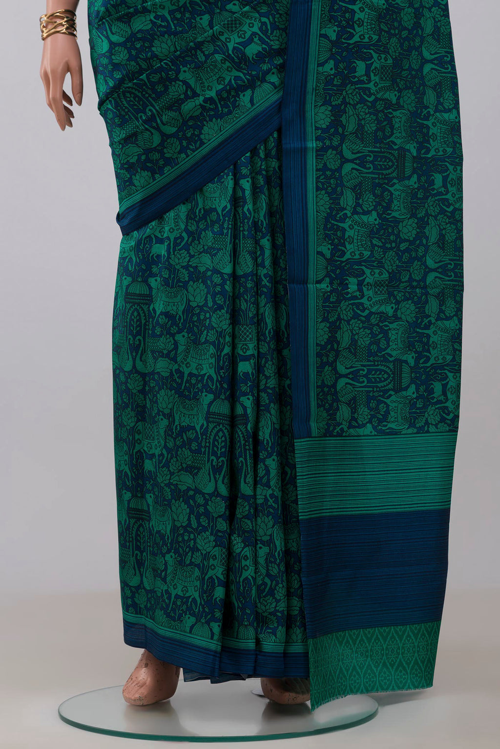 Pleats and pallu of Navy Blue Printed Silk Saree with Printed design on the body and Plain Border. 