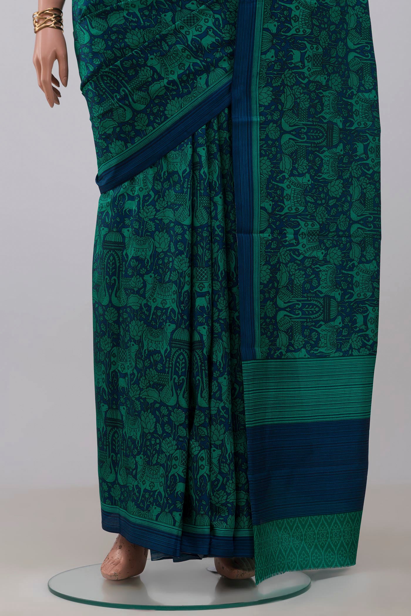 Pleats and pallu of Navy Blue Printed Silk Saree with Printed design on the body and Plain Border. 