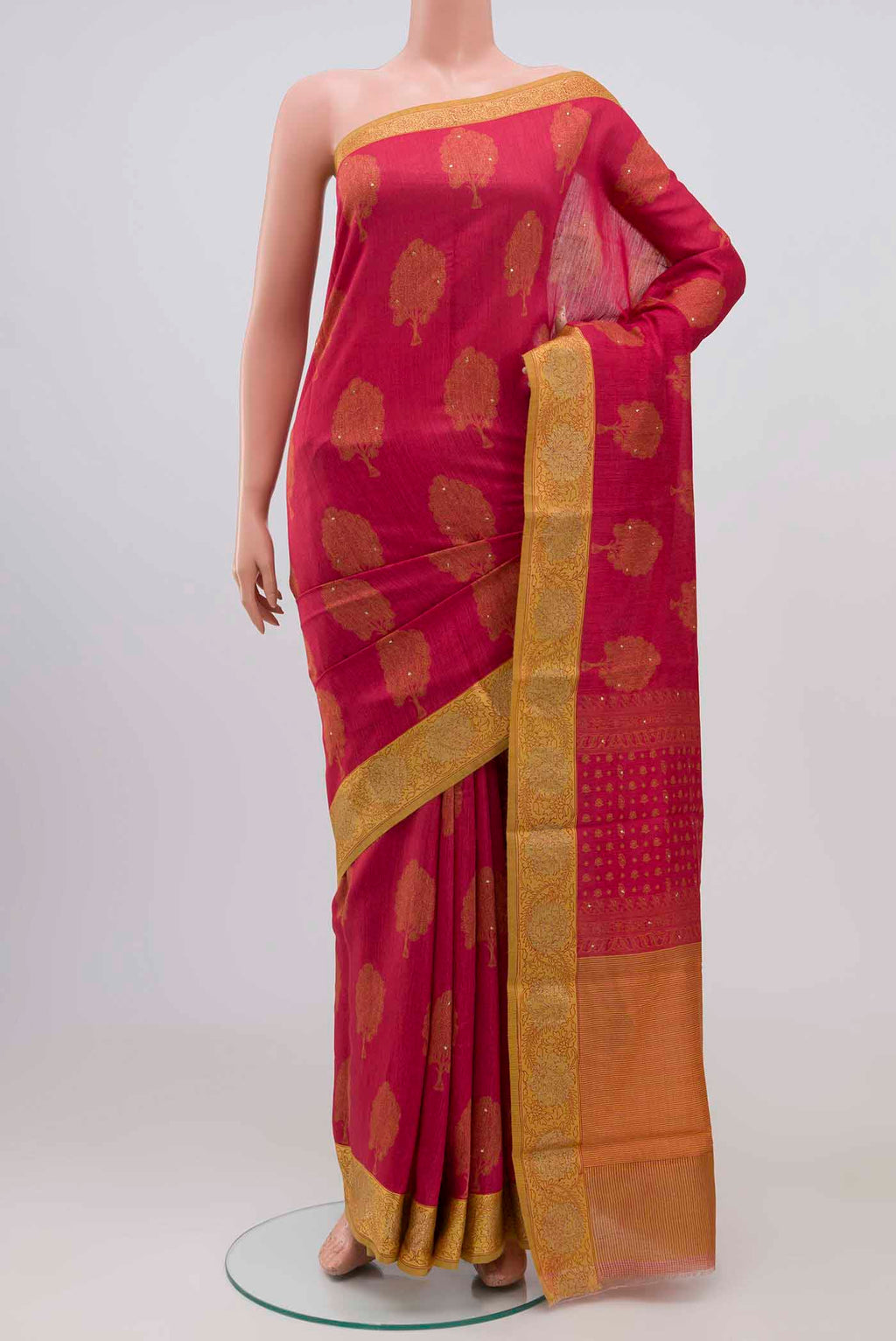 Dark Pink Tussar Silk Saree with Printed design on the body and Zari Border.  displayed on a mannequin