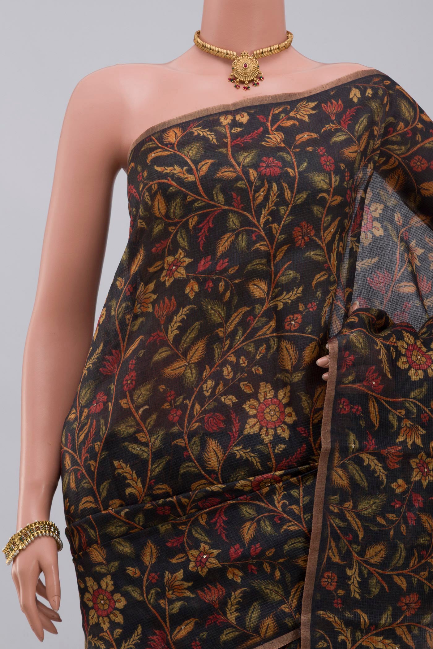 Border image of Black Tussar Silk Saree with Printed design on the body and Thin Zari Line. 