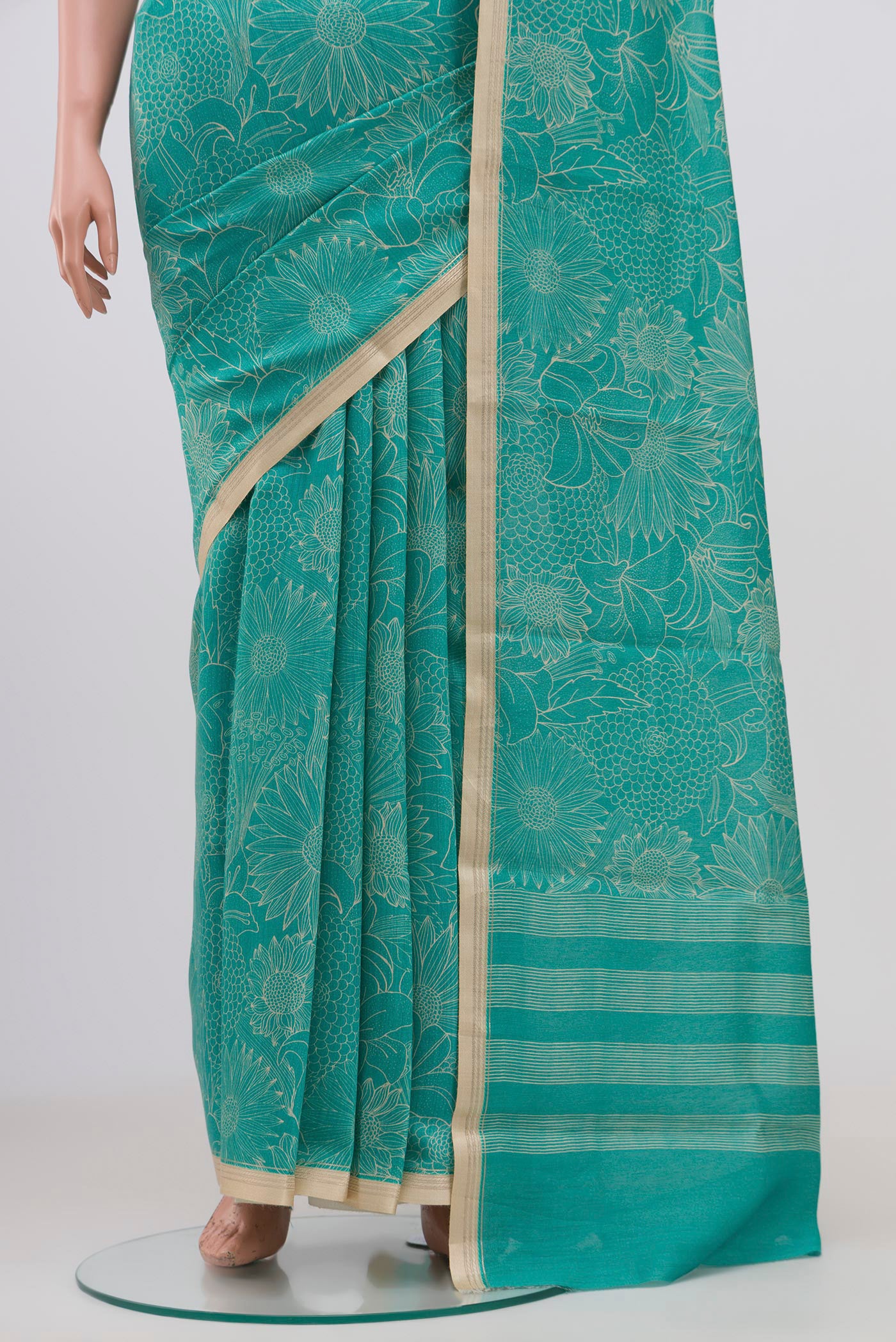 Pleats and pallu of Sky Blue Tussar Silk Saree with Floral Print on the body and Thin Zari Line. 