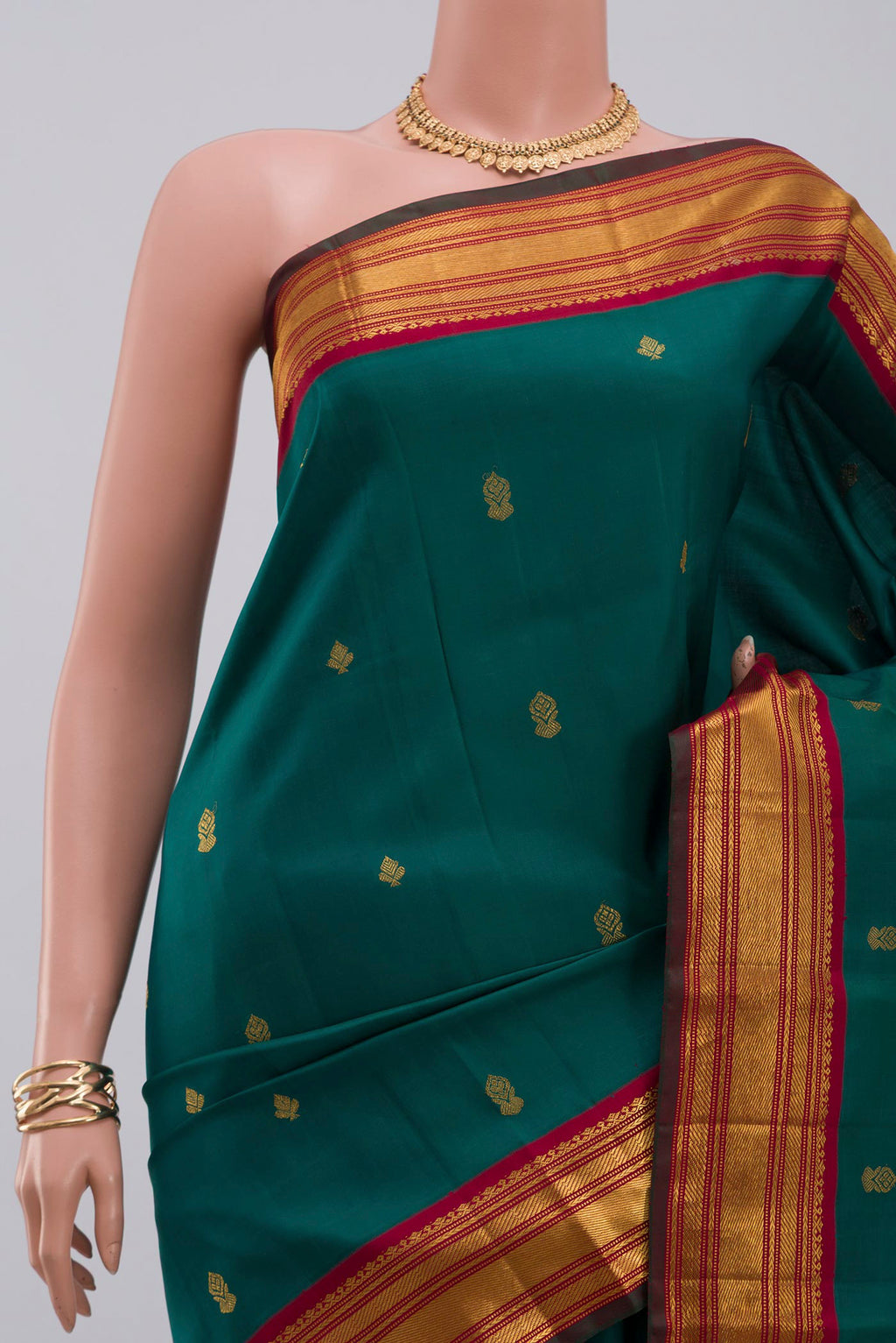 Border image of Pure Silk Pure Zari Green Kanchipuram Saree with Zari Butta on the body and Zari Border. 