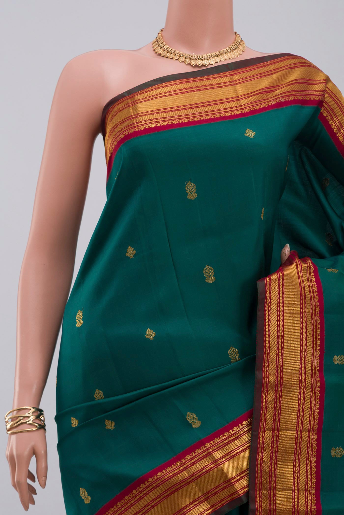Border image of Pure Silk Pure Zari Green Kanchipuram Saree with Zari Butta on the body and Zari Border. 
