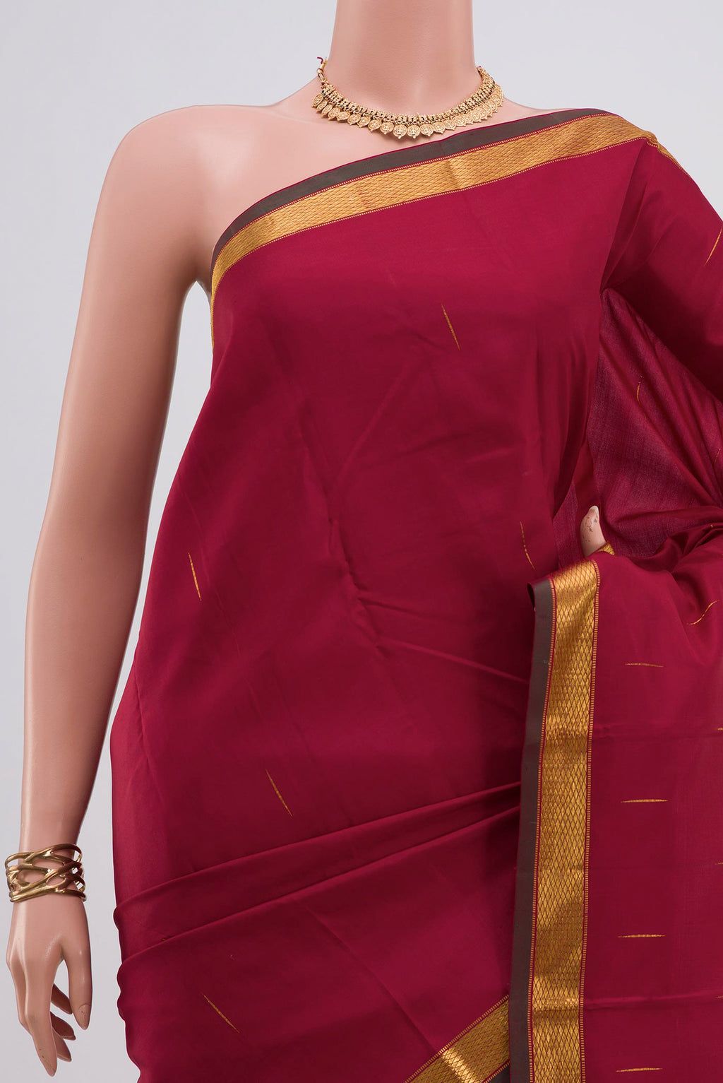 Border image of Pure Silk Pure Zari Maroon Kanjivaram Saree with Zari Butta on the body and Zari Border. 