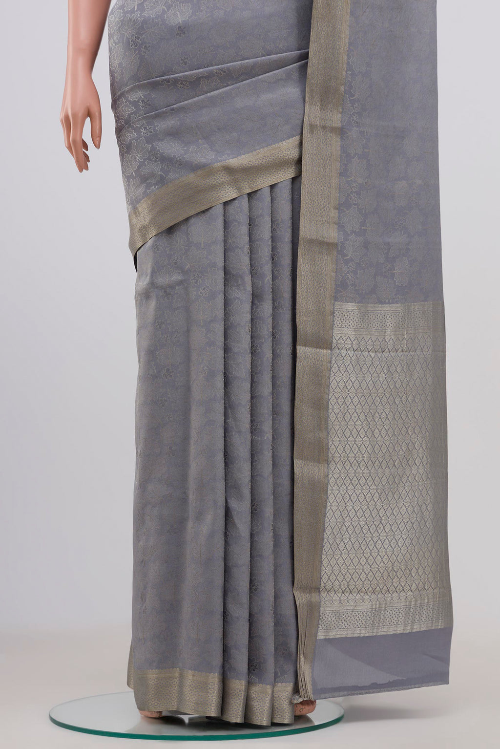 Pleats and pallu of Grey Mysore Crepe Saree with Zari Brocade on the body and Zari Border. 