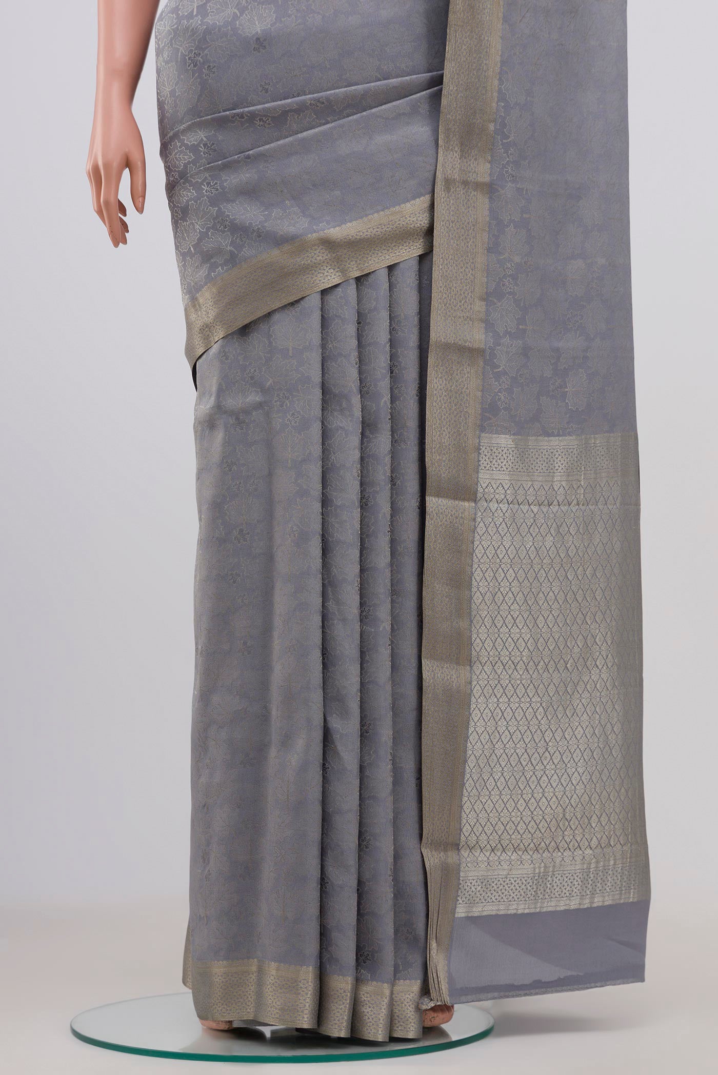 Pleats and pallu of Grey Mysore Crepe Saree with Zari Brocade on the body and Zari Border. 
