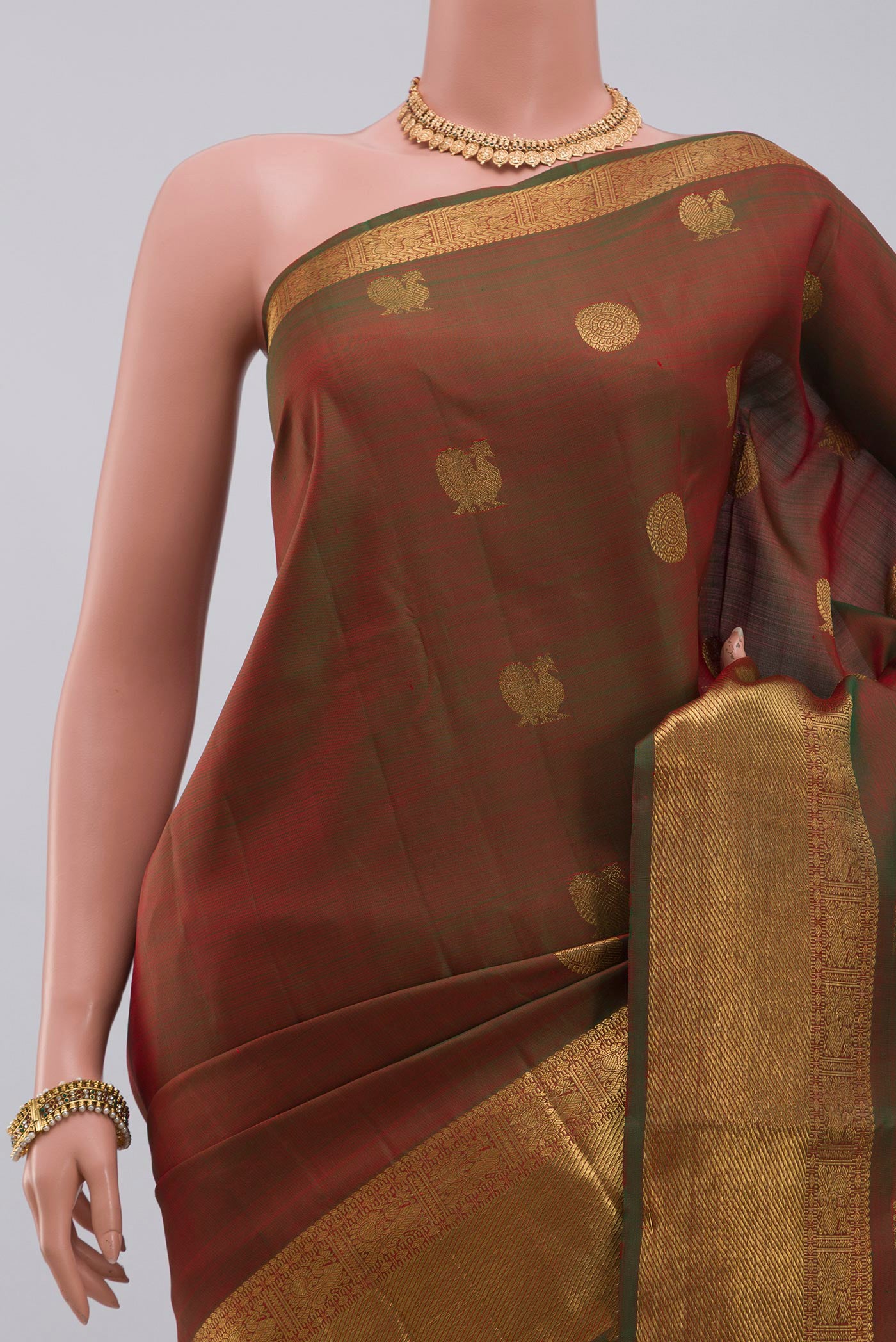 Border image of Pure Silk Pure Zari Green Kanchipuram Saree with Zari Butta on the body and Zari Border. 