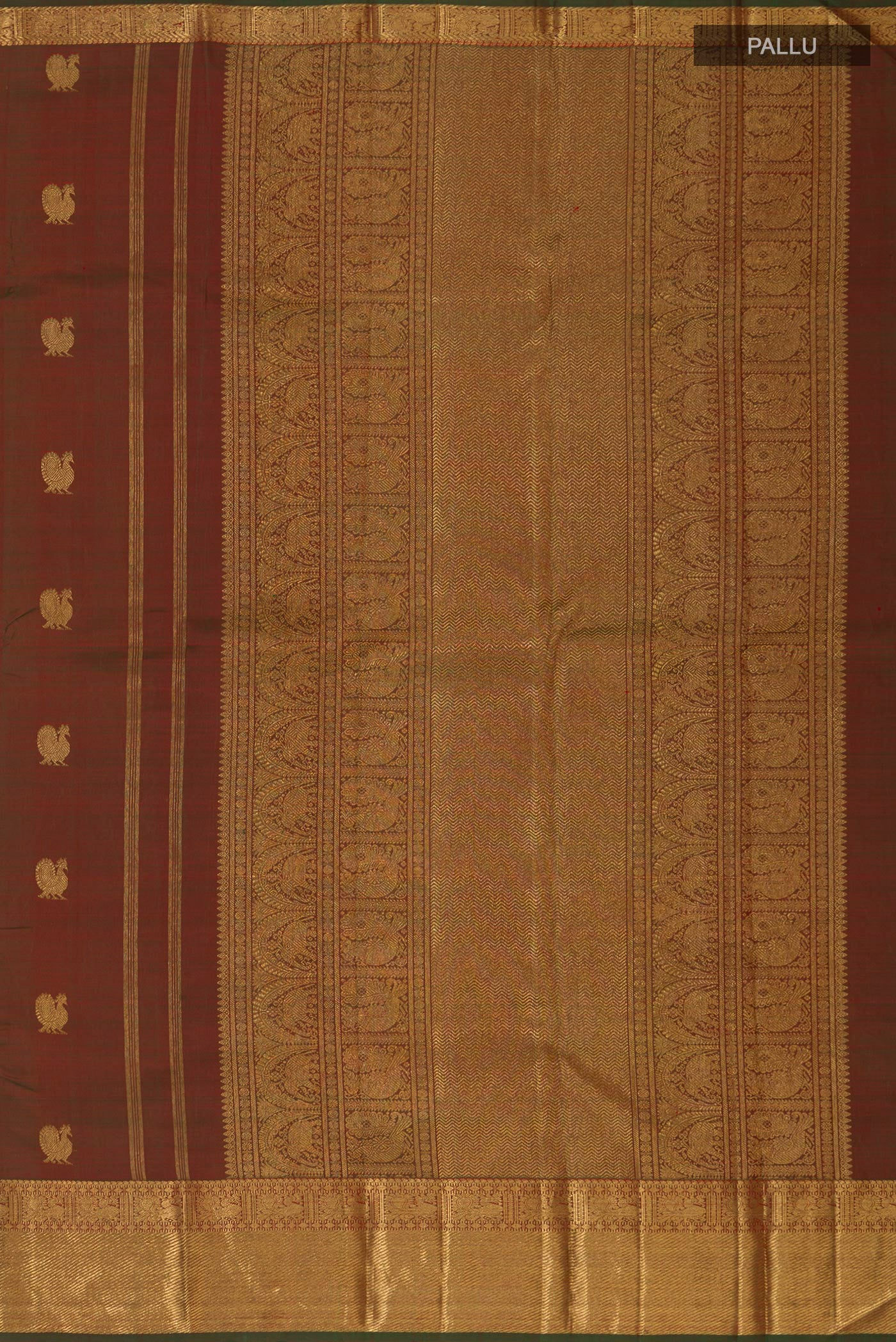 Close up image of the pallu of Pure Silk Pure Zari Green Kanchipuram Saree with Zari Butta on the body and Zari Border. 
