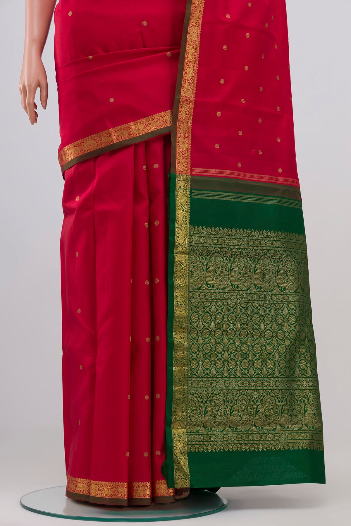 Pleats and pallu of Pure Silk Pure Zari Maroon Kanchipuram Saree with Zari Butta on the body and Zari Border. 