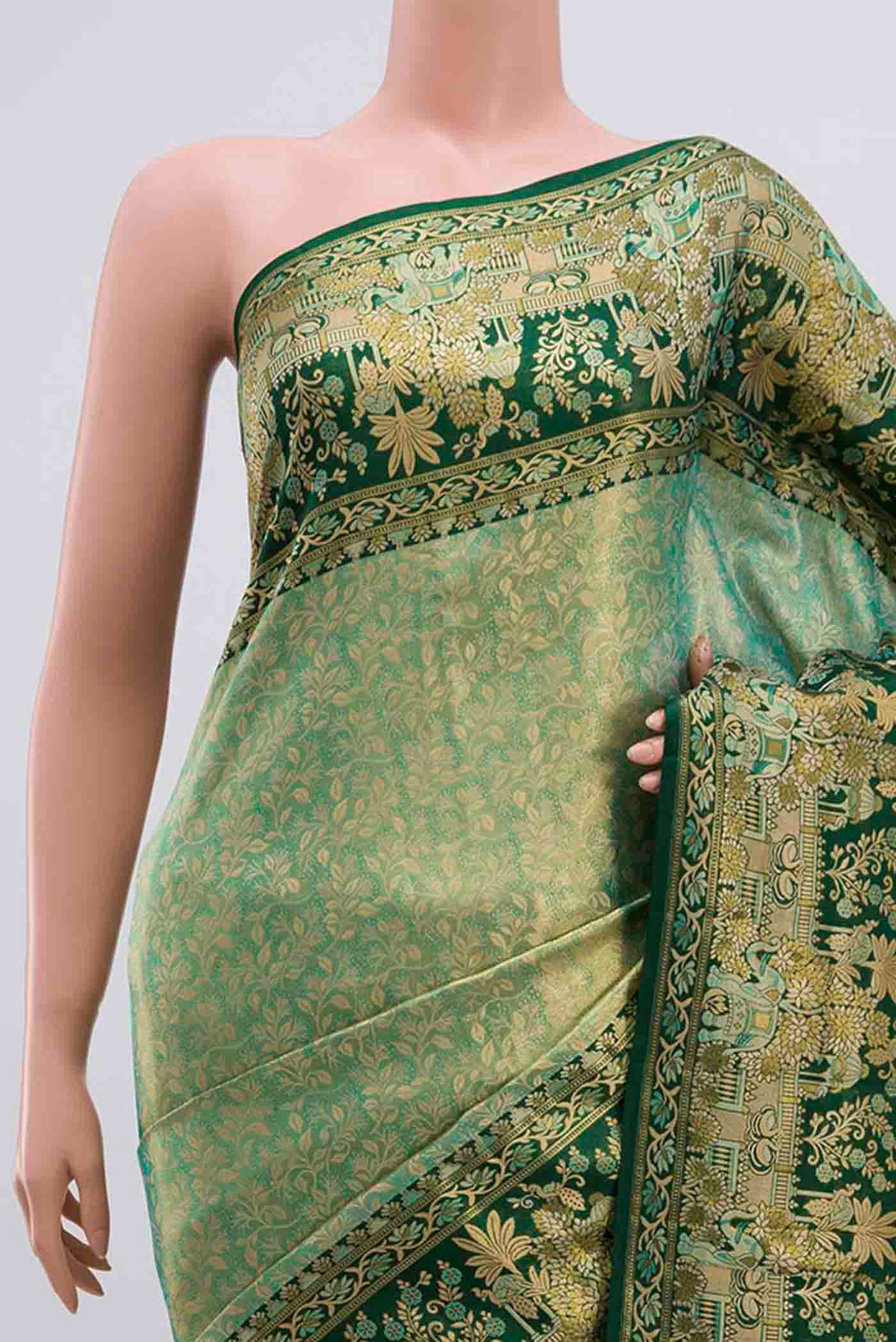 Border image of green with gold Color Kanjivaram Tissue Silk Saree with Zari Brocade on the body and Zari Border. 