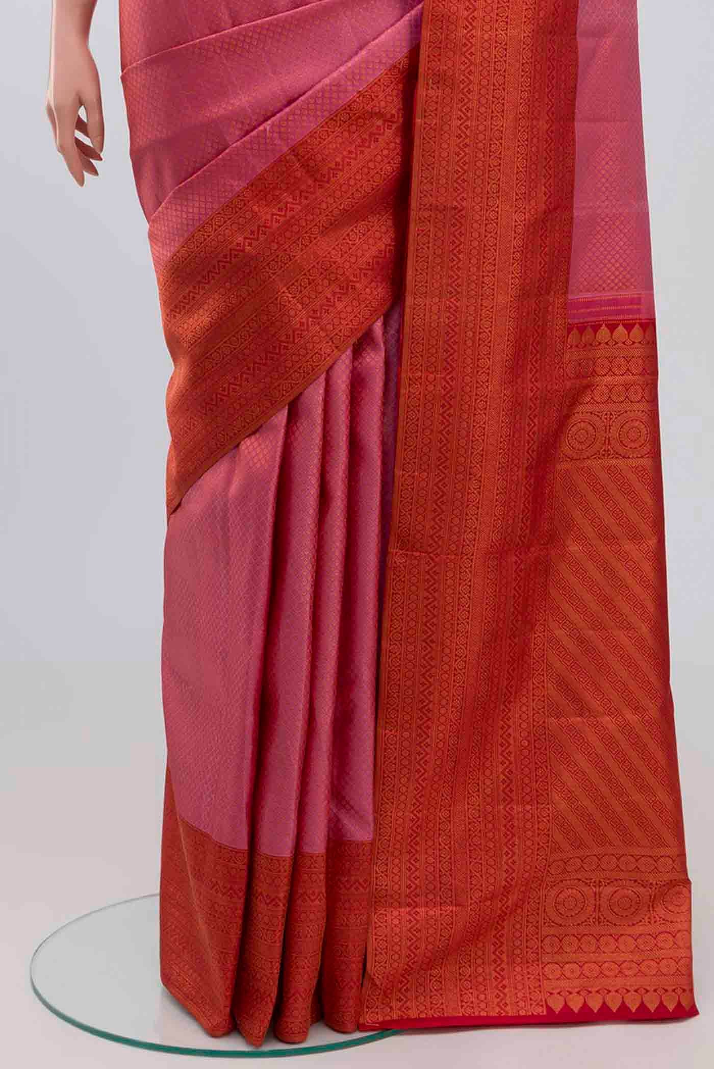 Pleats and pallu of Pink Kanchipuram Silk Saree with Zari Brocade on the body and Zari Border. 