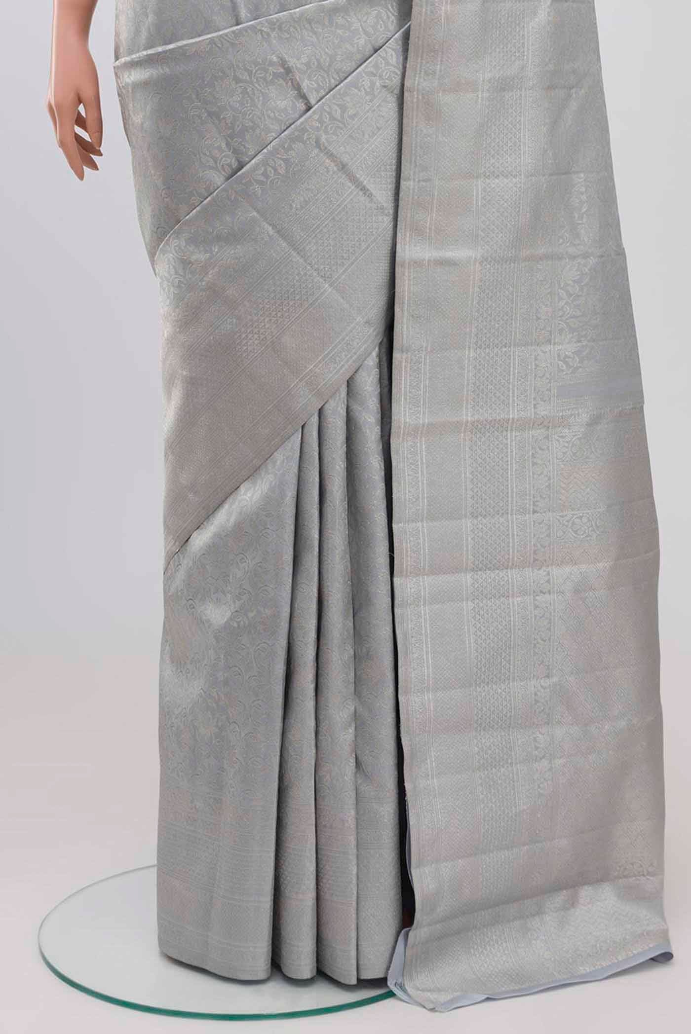 Pleats and pallu of Grey Kanchipuram Silk Saree with Zari Brocade on the body and Zari Border. 