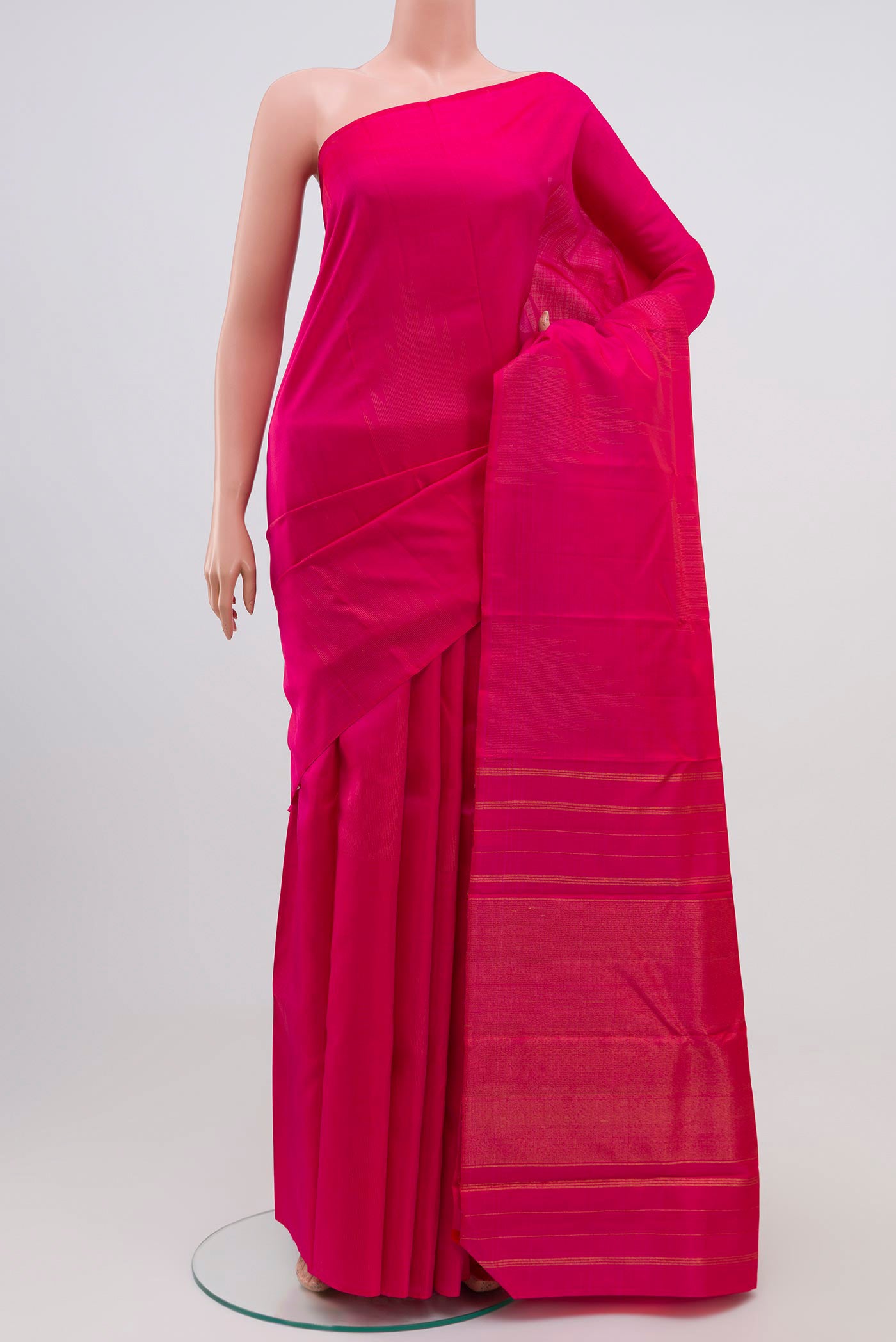 Pink Kanjivaram Silk Saree with Zari Butta on the body and Temple Border.  displayed on a mannequin