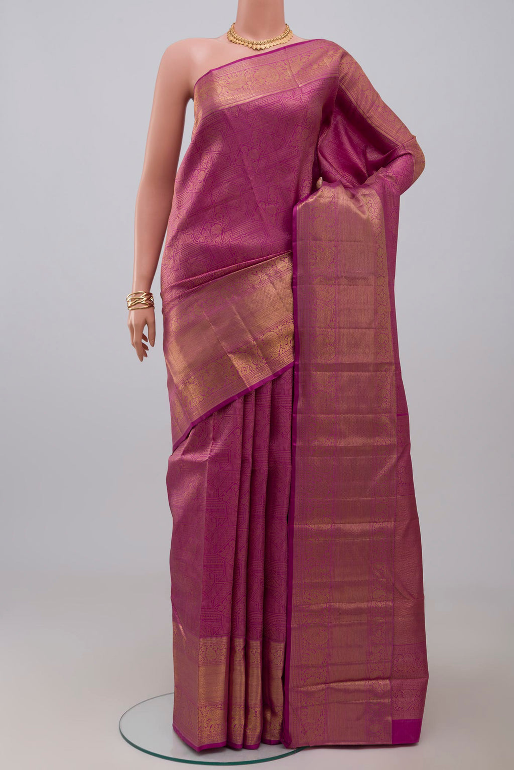 Pink Kanchipuram Silk Saree with Zari Brocade on the body and Zari Border.  displayed on a mannequin