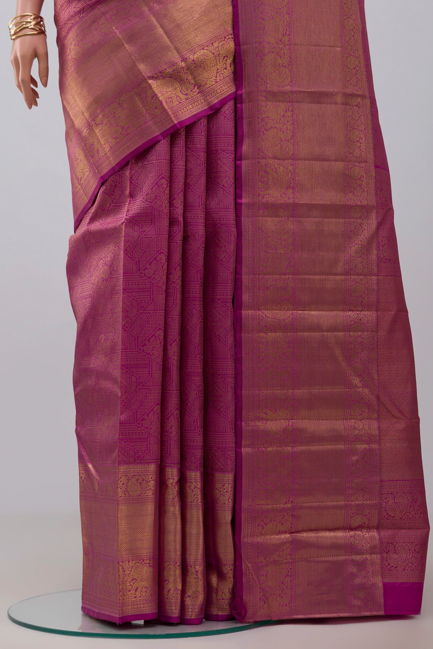 Pleats and pallu of Pink Kanchipuram Silk Saree with Zari Brocade on the body and Zari Border. 