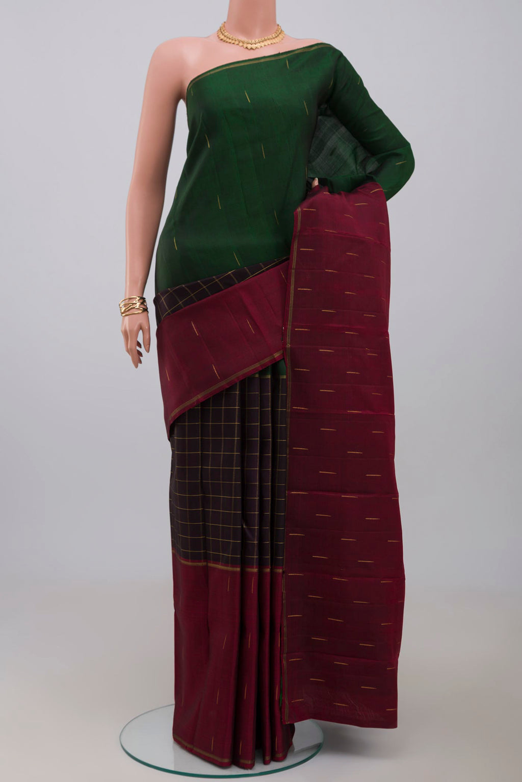 Pure Silk Pure Zari Black Kanchipuram Saree with Checked design on the body and Ganga Jamuna Border.  displayed on a mannequin