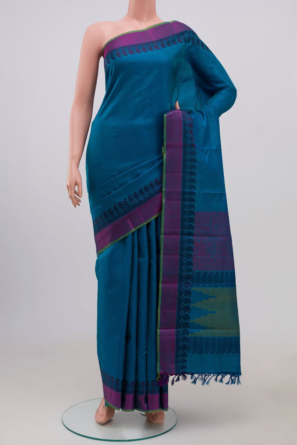 Blue Kanchipuram Silk Saree with Plain Body and Thread Border.  displayed on a mannequin