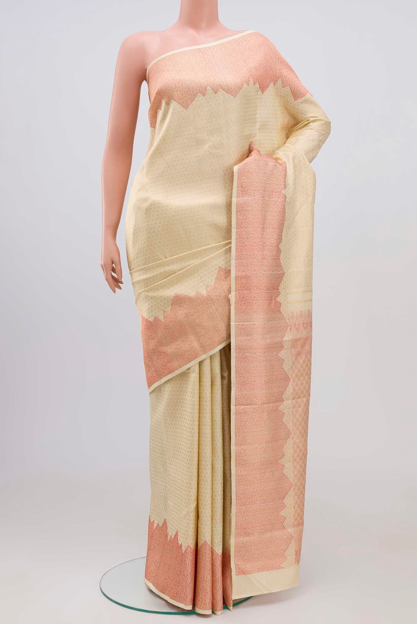 Cream Kanchipuram Silk Saree with Zari Brocade on the body and Temple Border.  displayed on a mannequin