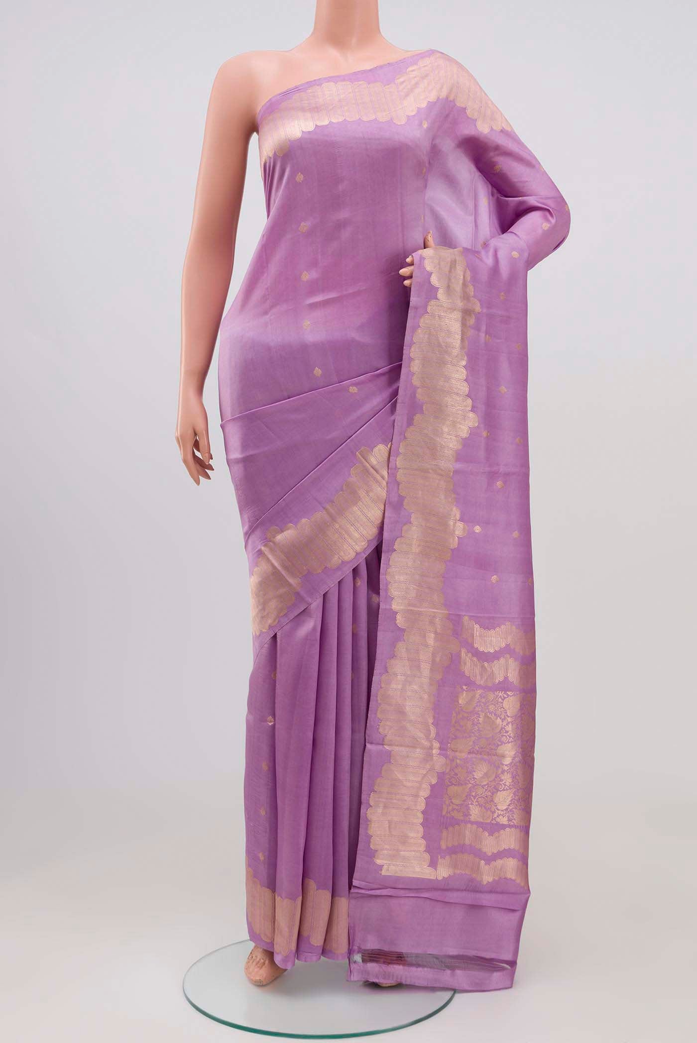Lavender Banarasi Katan Silk Saree with Zari Butta on the body and Zari Border.  displayed on a mannequin