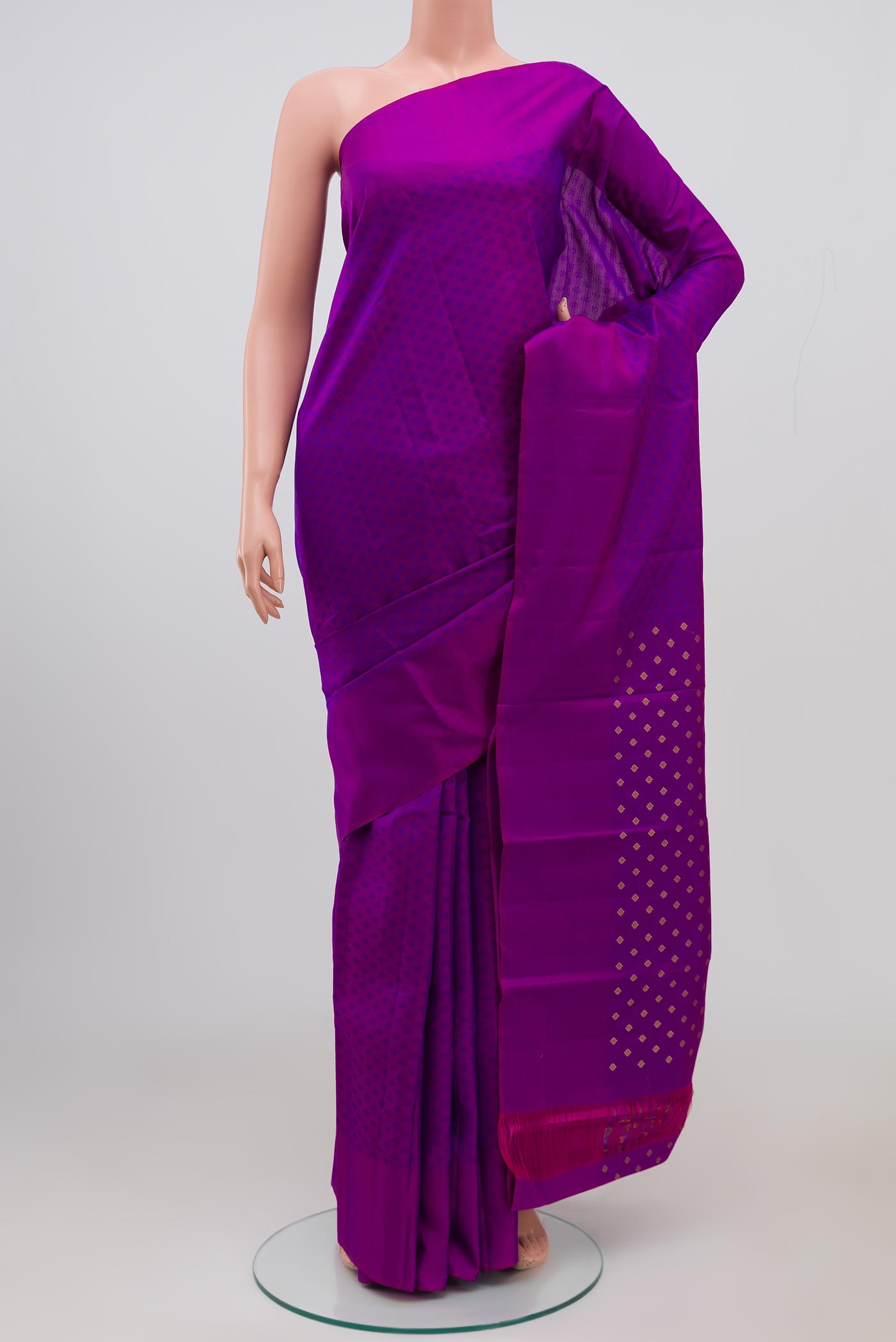 Purple Kanjivaram Saree with Jacquard design on the body and Plain Border.  displayed on a mannequin