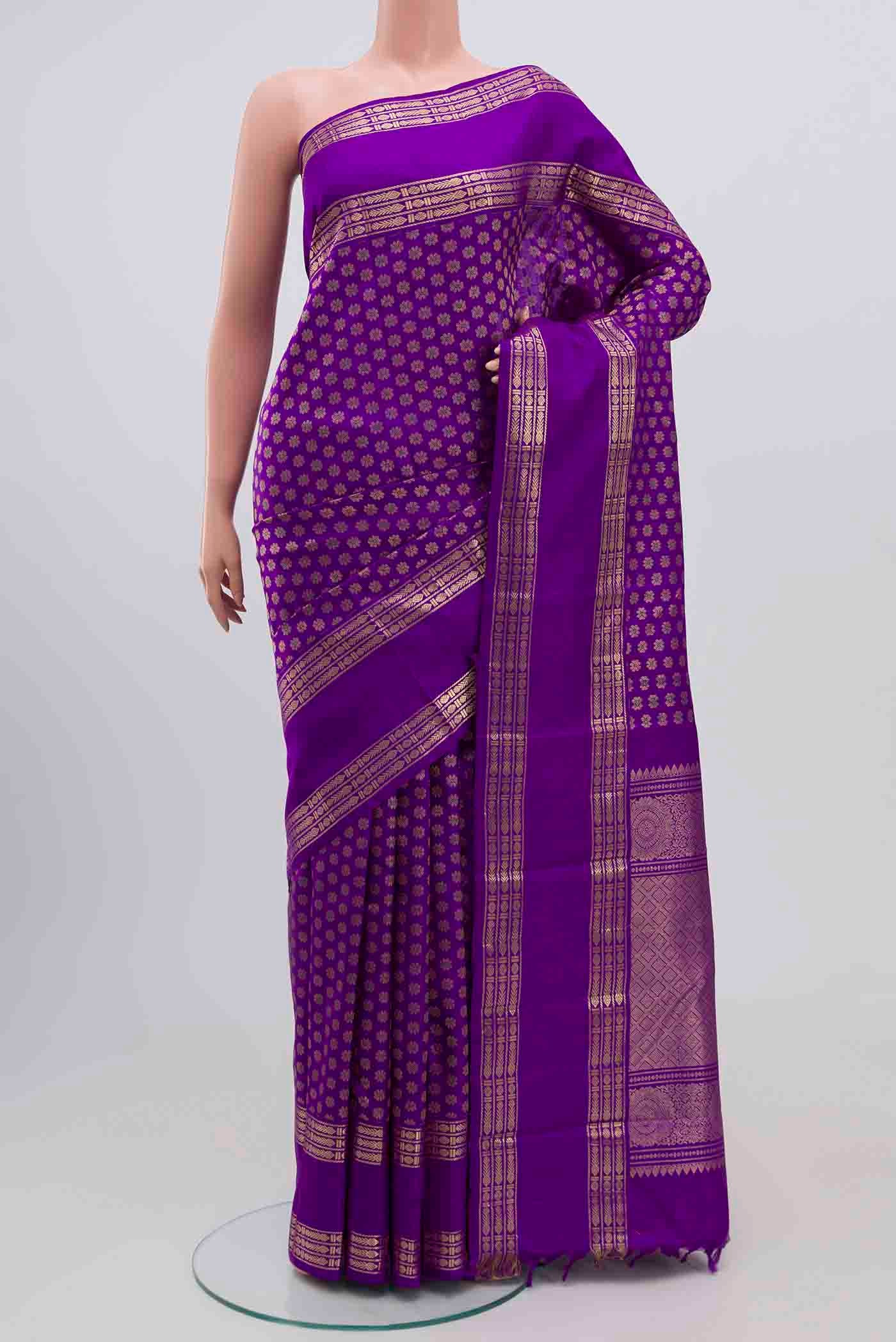 Purple Kanjivaram Silk Saree with Zari Brocade on the body and Zari Border.  displayed on a mannequin