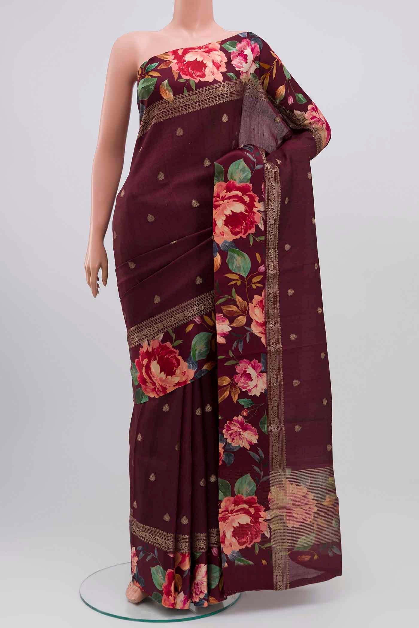 Burgundy Tussar Silk Saree with Zari Butta on the body and Fancy Border displayed on a mannequin