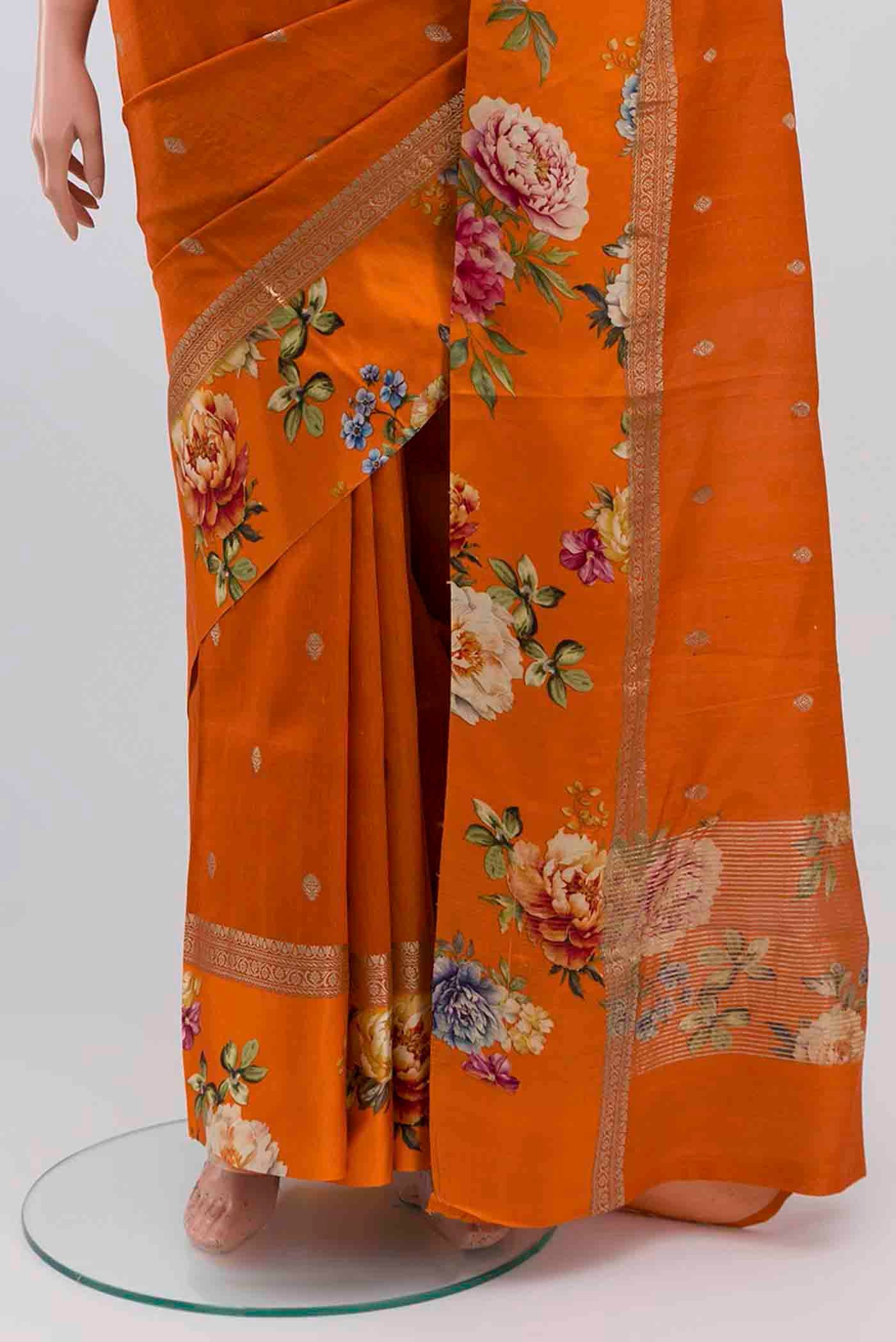 Pleats and pallu of Orange Tussar Silk Saree with Zari Butta on the body and Fancy Border