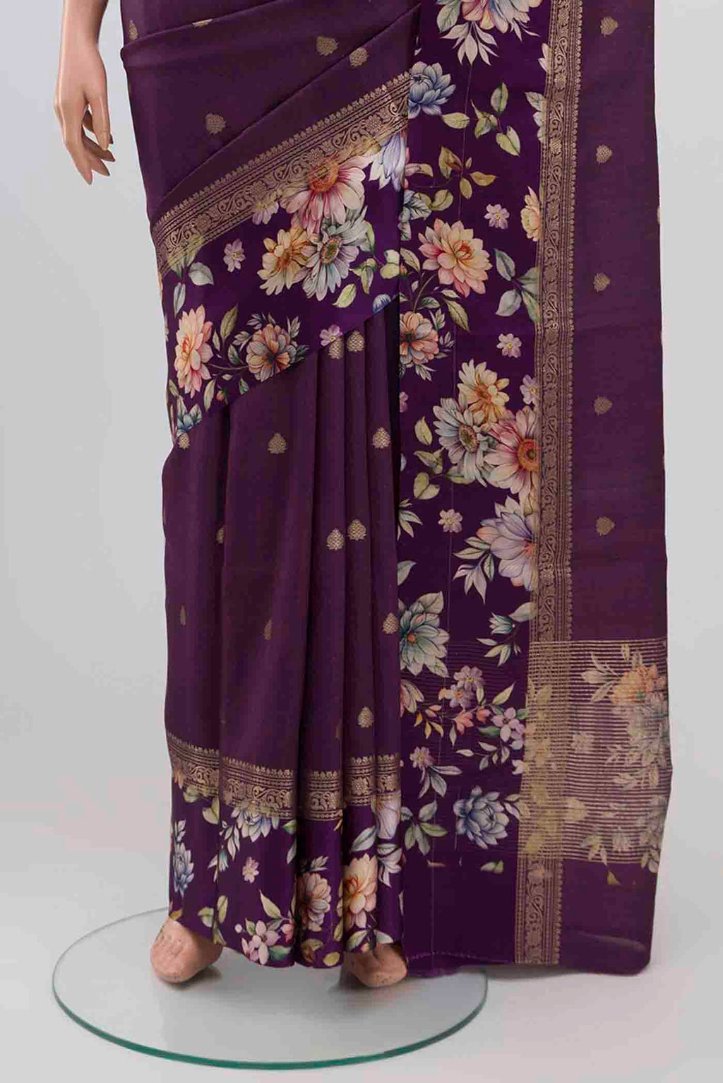 Pleats and pallu of Purple Tussar Silk Saree with Zari Butta on the body and Printed Border. 