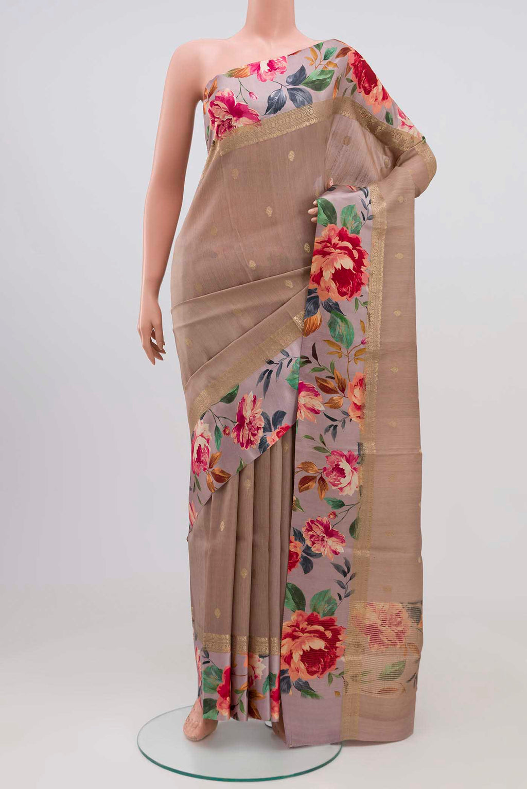 Brown Tussar Silk Saree with Zari Butta on the body and Printed Border.  displayed on a mannequin