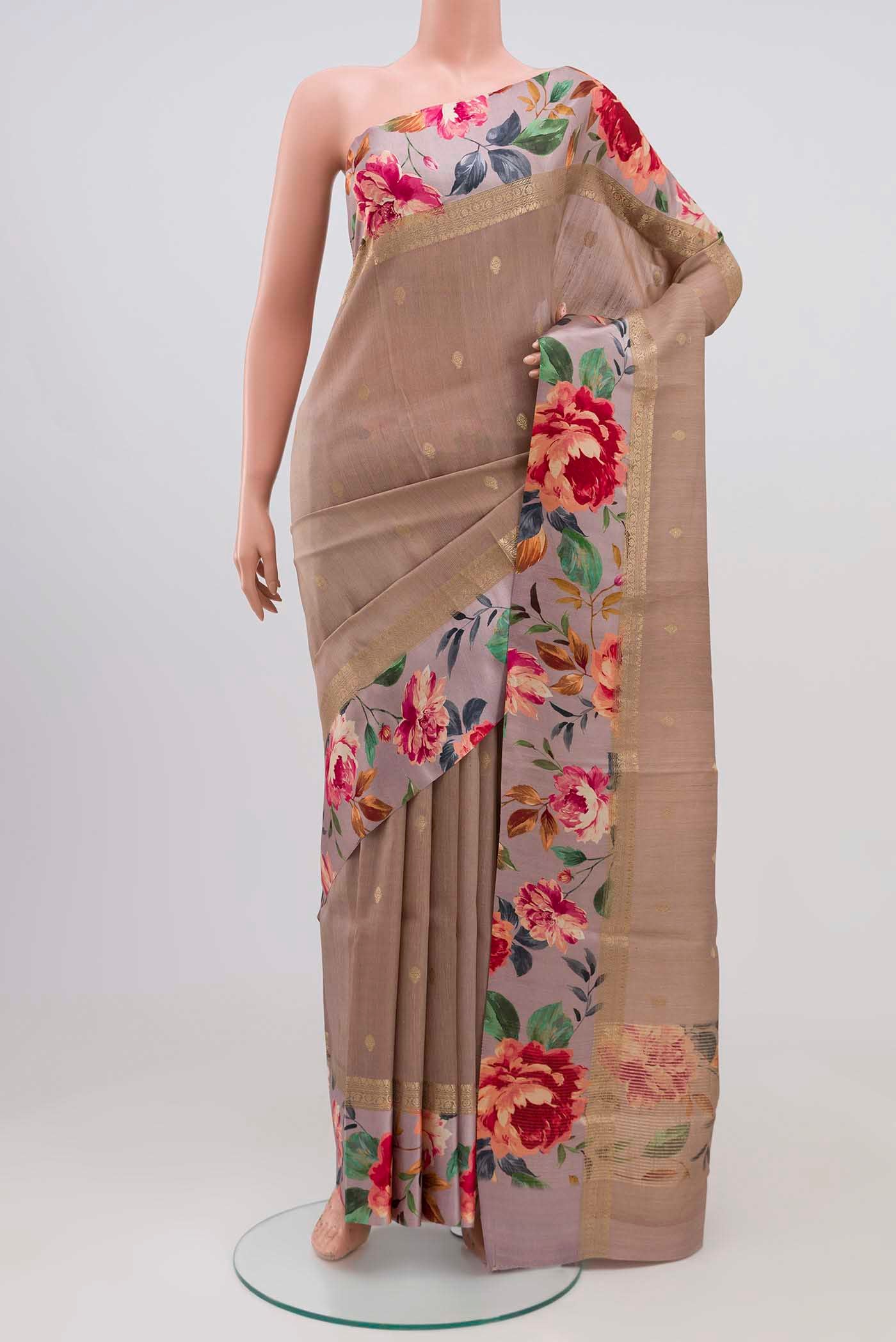 Brown Tussar Silk Saree with Zari Butta on the body and Printed Border.  displayed on a mannequin