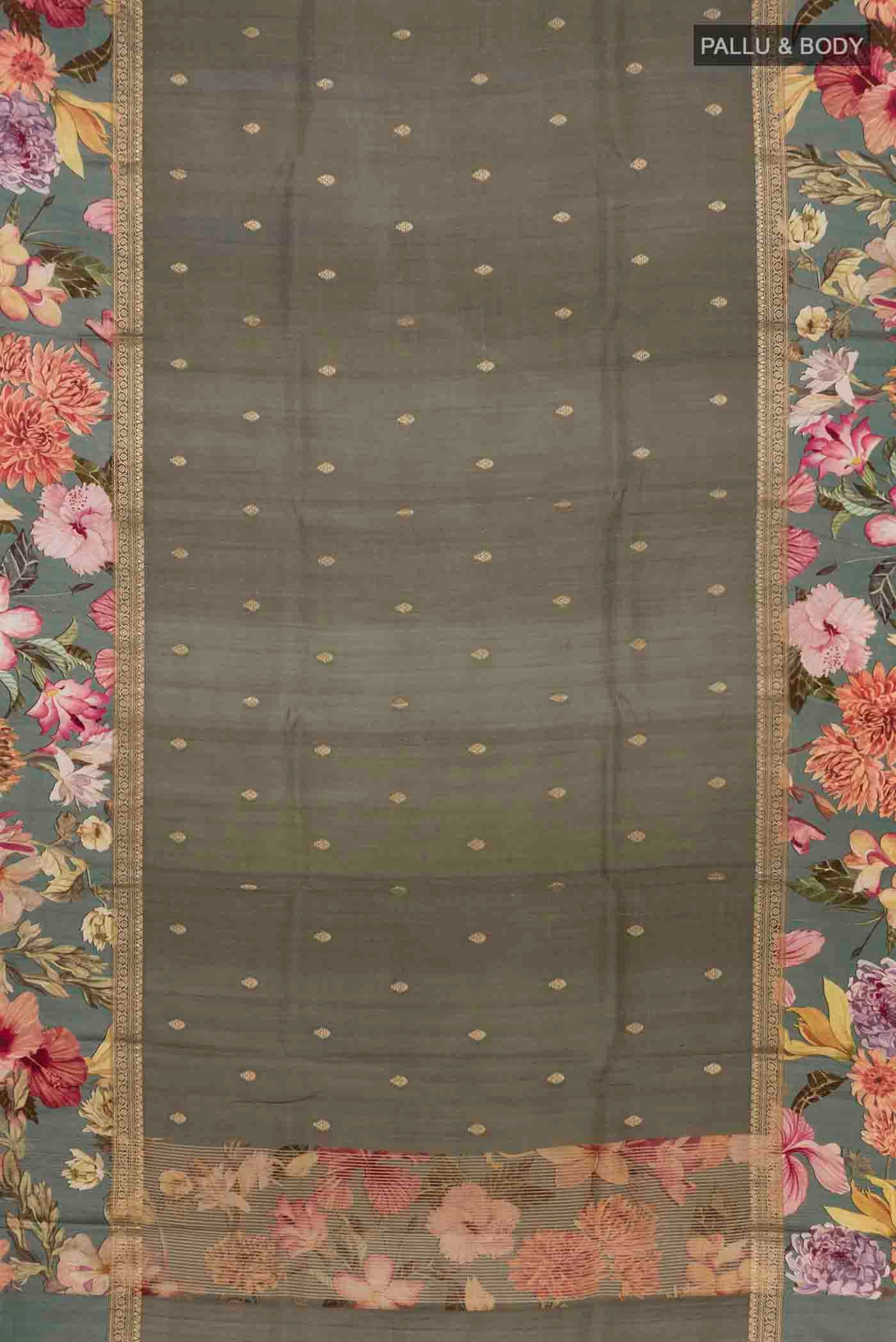 Flat view of Grey Tussar Silk Saree with Zari Butta on the body and Printed Border. 