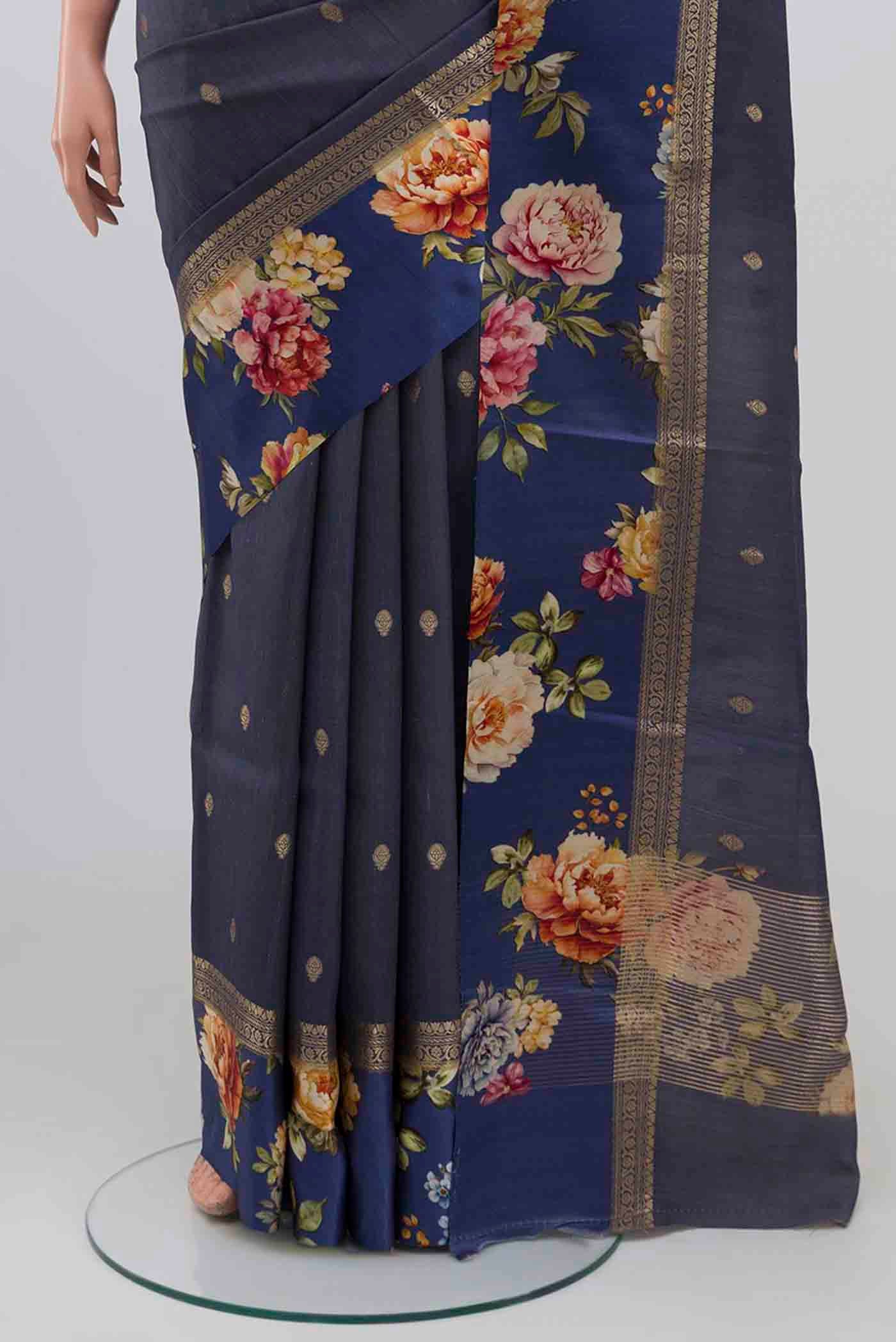 Pleats and pallu of Blue Grey Tussar Silk Saree with Zari Butta on the body and Printed Border. 
