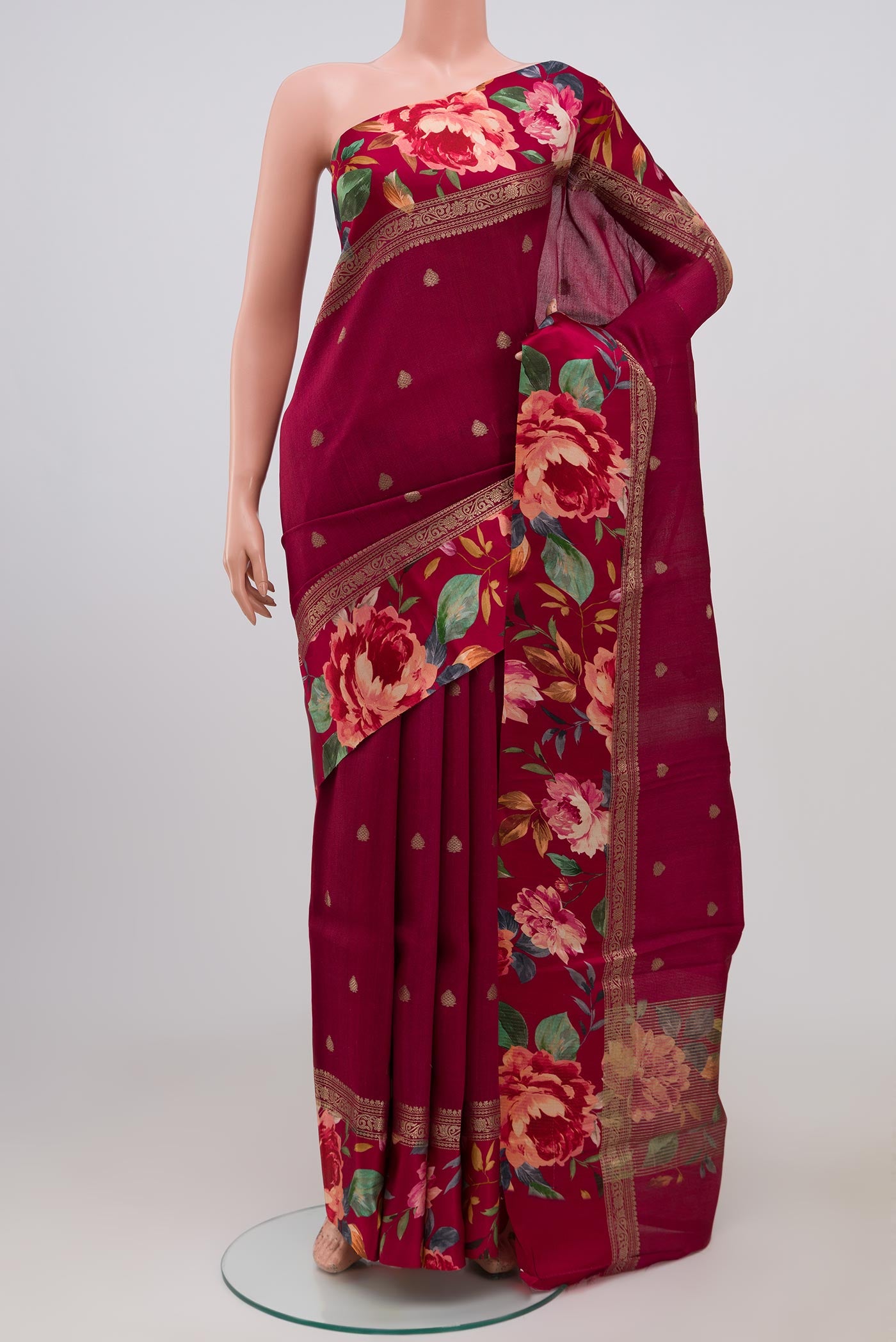 Burgundy Tussar Silk Saree with Zari Butta on the body and Fancy Border.  displayed on a mannequin
