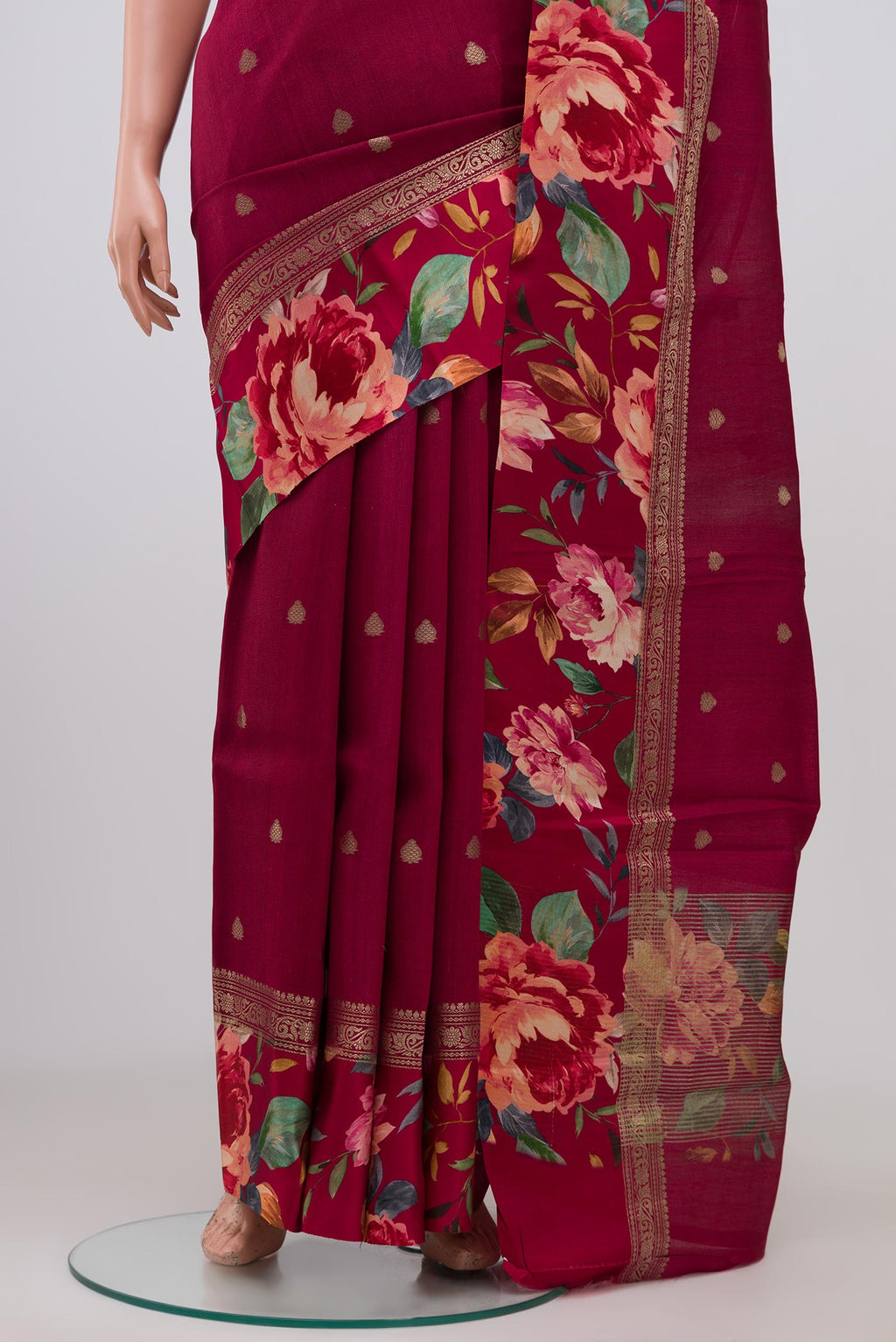 Pleats and pallu of Burgundy Tussar Silk Saree with Zari Butta on the body and Fancy Border. 