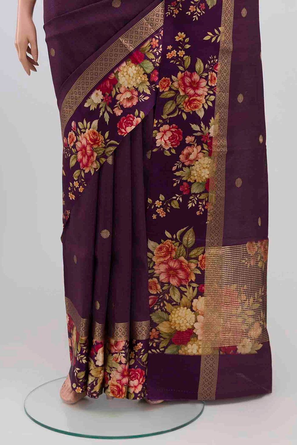 Pleats and pallu of Purple Tussar Silk Saree with Zari Butta on the body and Printed Border. 