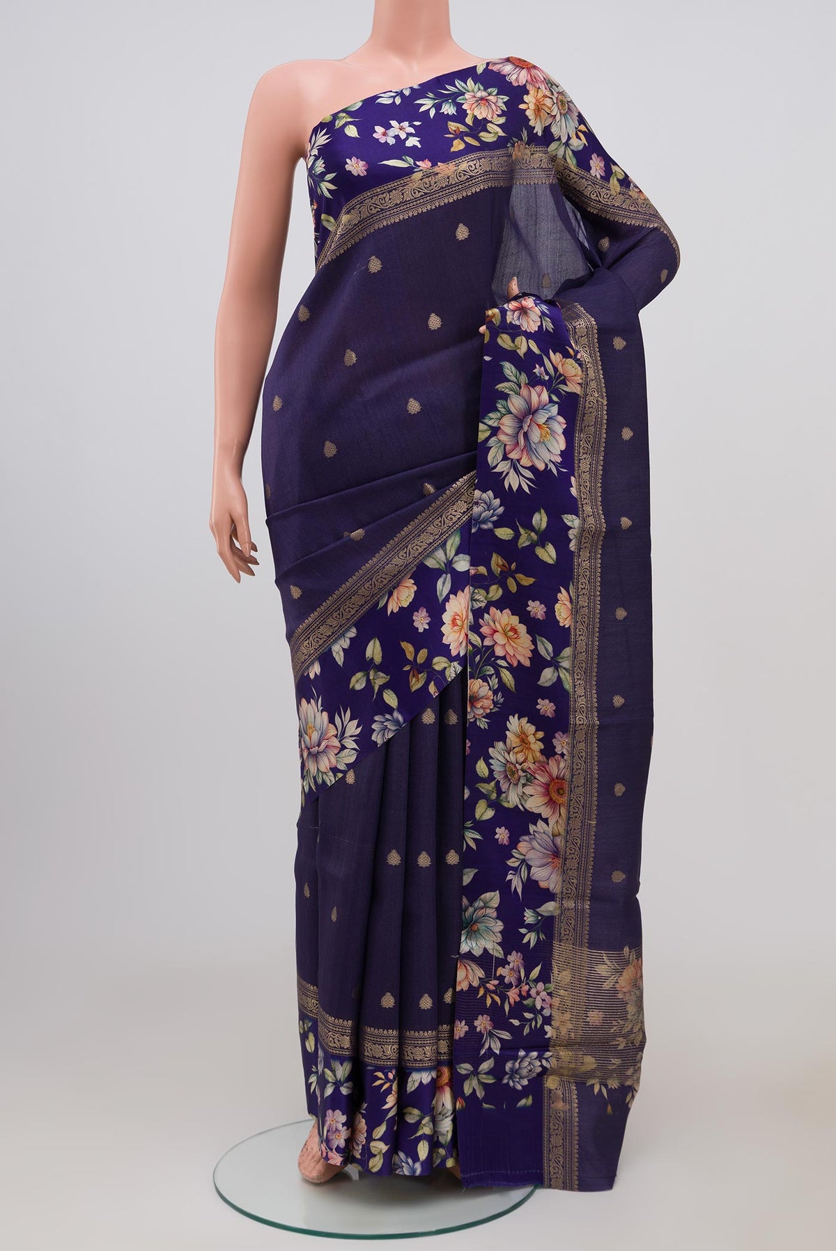 Blue Tussar Silk Saree with Zari Butta on the body and Fancy Border.  displayed on a mannequin