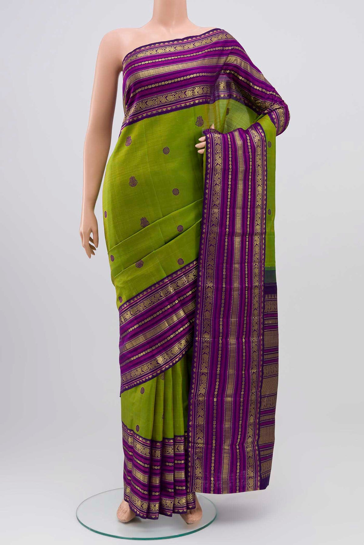 Green Kanchipuram Silk Saree with Thread Butta on the body and Zari Border displayed on a mannequin